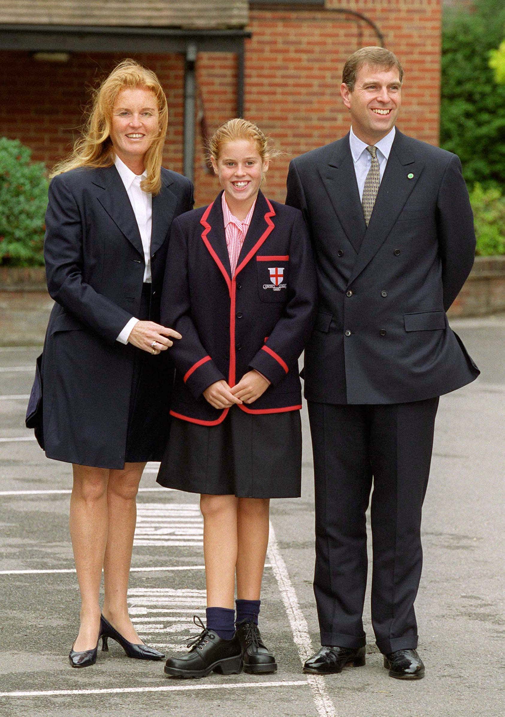 Princess Beatrice poses with her parents the Duke and Dutches of York on her first day of school at St. George's September 6, 2000 in Ascot, England.