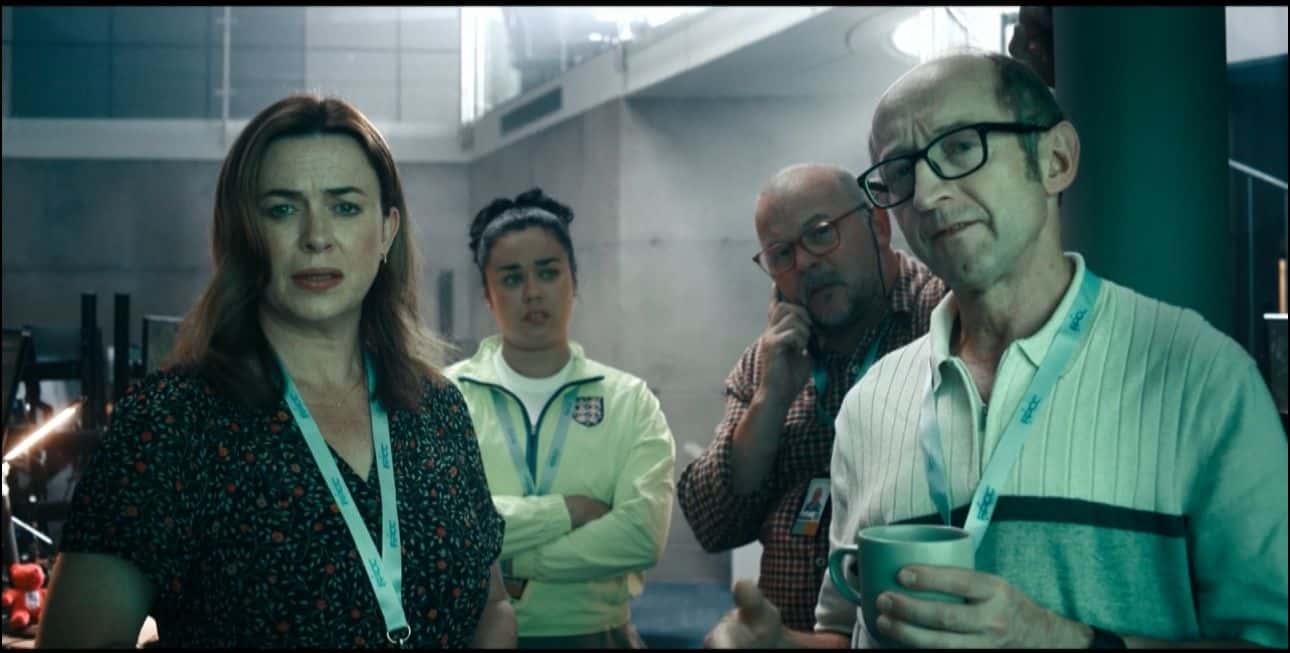 A still from 'Hijack' starring Eve Myles as Alice Sinclair, Tom Bonington as Michael, James Barriscale as Simon, and Hanora Kamen as Carmella (Apple TV+)