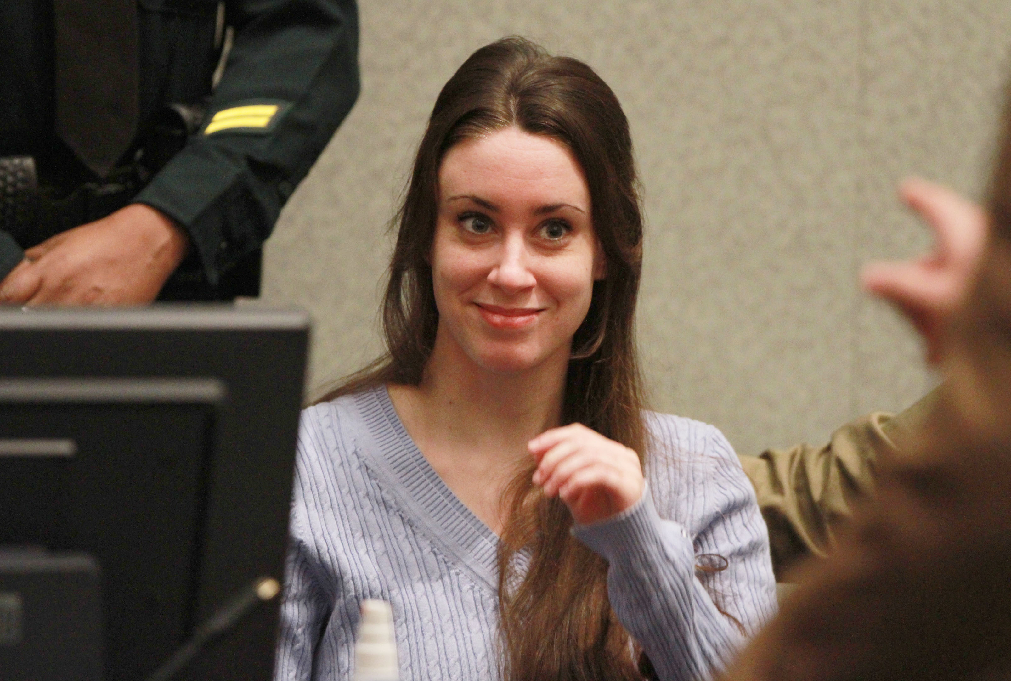Casey Anthony smiles before the start of her sentencing hearing on charges of lying to a law enforcement officer at the Orange County Courthouse July 7, 2011, in Orlando, Florida. (Getty Images)