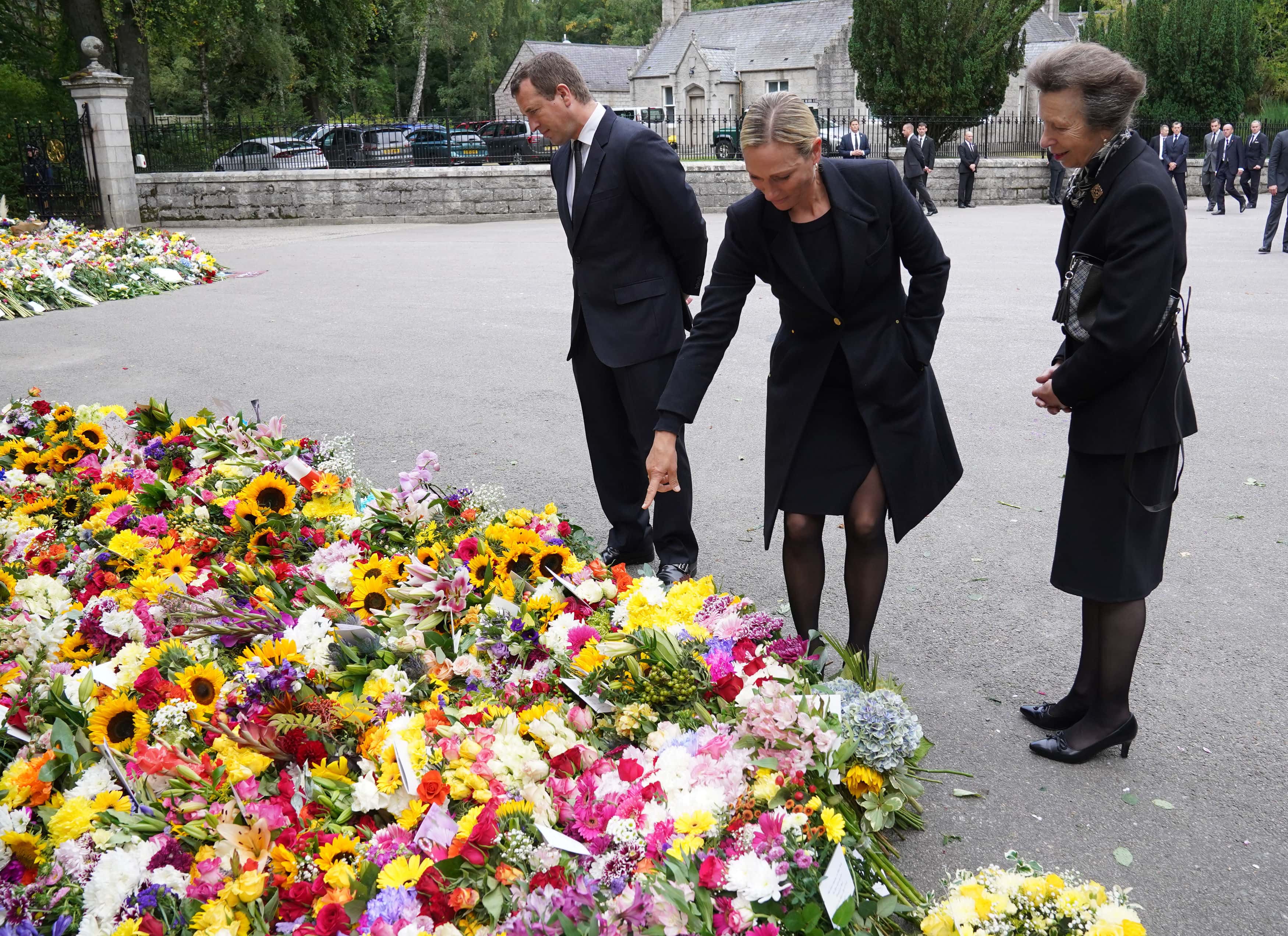 Peter Phillips, Zara Tindall, and Princess Anne, Princess Royal look at messages and floral tributes left by members of the public after attending a service at Crathie Kirk church near Balmoral following the death of Queen Elizabeth II on September 10, 2022 in Crathie near Aberdeen, United Kingdom. Elizabeth Alexandra Mary Windsor was born in Bruton Street, Mayfair, London on 21 April 1926. She married Prince Philip in 1947 and acceded to the throne of the United Kingdom and Commonwealth on 6 February 1952 after the death of her Father, King George VI. Queen Elizabeth II died at Balmoral Castle in Scotland on September 8, 2022, and is succeeded by her eldest son, King Charles III.