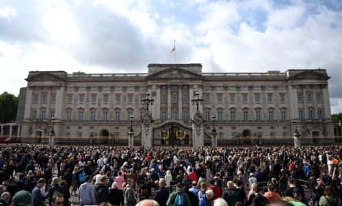 Crowds gather outside Buckingham Palace on September 09, 2022 in London, United Kingdom. Elizabeth Alexandra Mary Windsor was born in Bruton Street, Mayfair, London on 21 April 1926. She married Prince Philip in 1947 and acceded the throne of the United Kingdom and Commonwealth on 6 February 1952 after the death of her Father, King George VI. Queen Elizabeth II died at Balmoral Castle in Scotland on September 8, 2022, and is succeeded by her eldest son, King Charles III.
