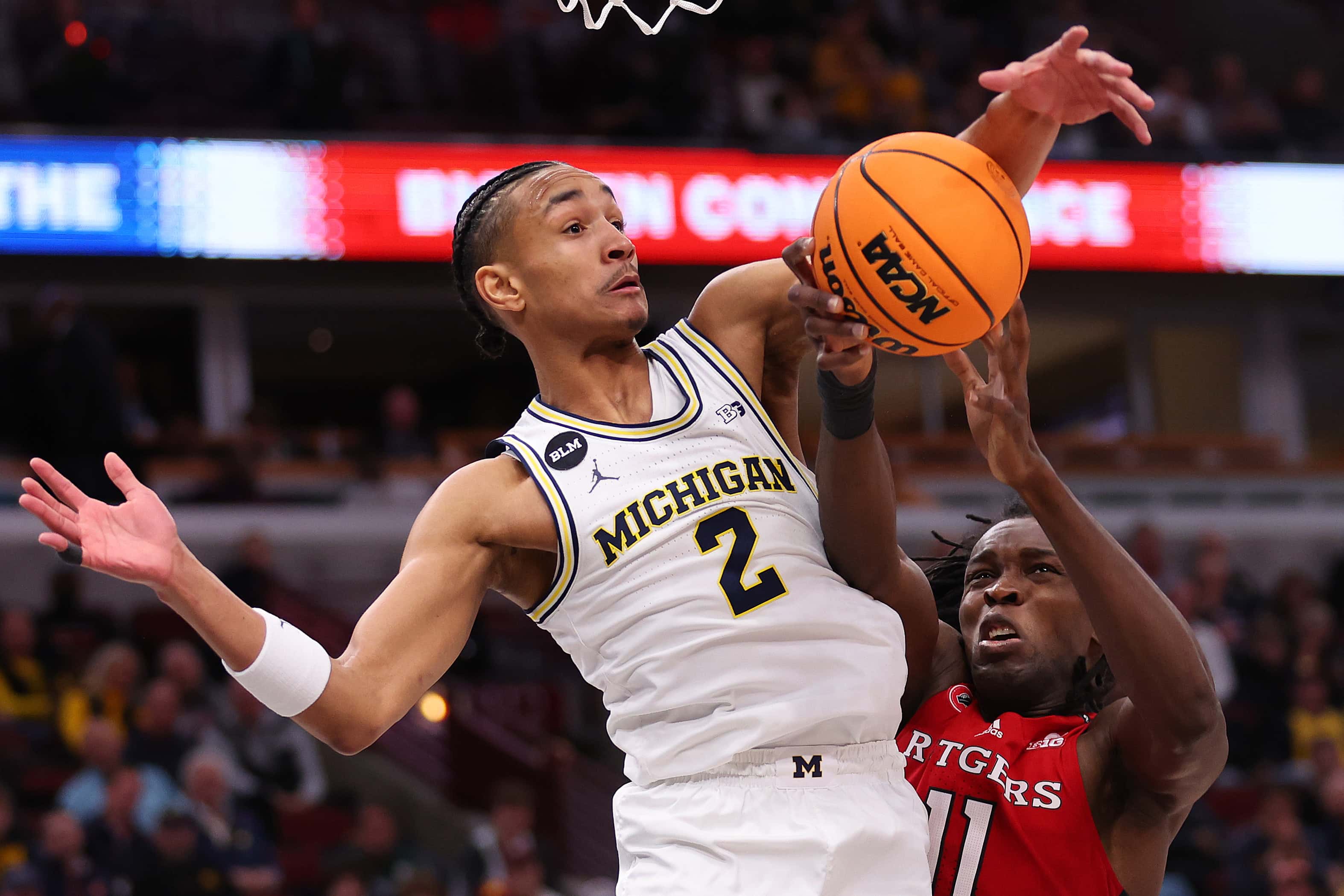 Kobe Bufkin #2 of the Michigan Wolverines and Clifford Omoruyi #11 of the Rutgers Scarlet Knights battle for a rebound in the second half of the second round of the Big Ten Tournament at United Center on March 09, 2023, in Chicago, Illinois. (Photo by Michael Reaves/Getty Images)