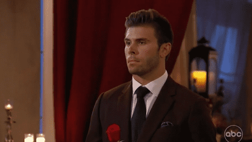 'The Bachelor' Season 27 star Zach Shallcross standing holding a rose (ABC)