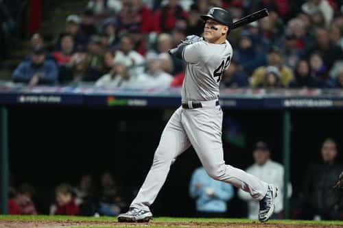 Anthony Rizzo #48 of the New York Yankees hits a double against the Cleveland Guardians during the sixth inning in game four of the American League Division Series at Progressive Field on October 16, 2022 in Cleveland, Ohio.