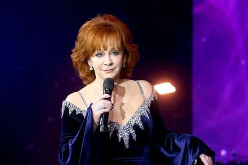 Reba McEntire speaks onstage during Inaugural Gateway Celebrity Fight Night on March 12, 2022 in Phoenix, Arizona. (Photo by Phillip Faraone/Getty Images for Gateway Celebrity Fight Night Foundation )