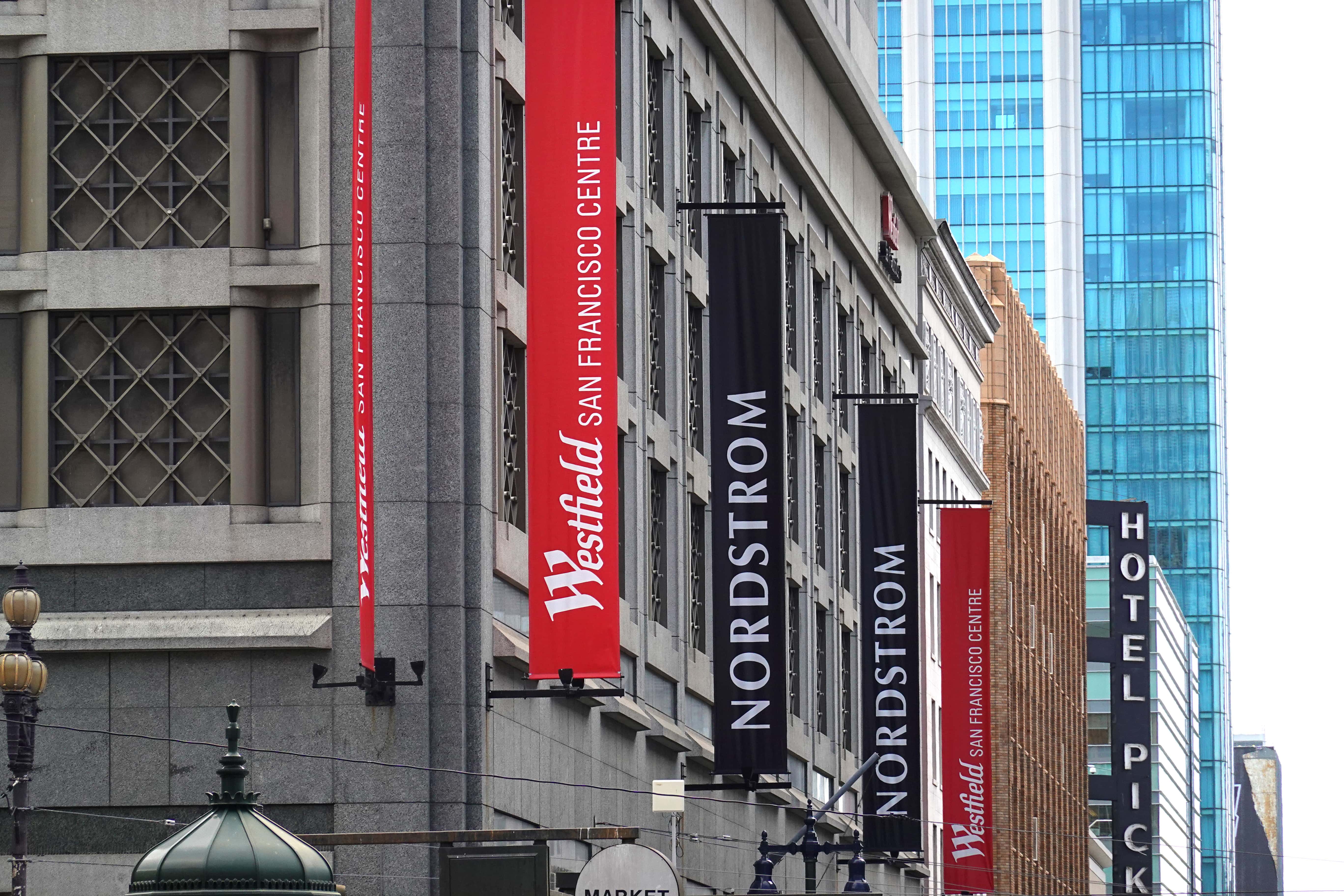 Signs are posted on the exterior of the Westfield San Francisco Centre on April 13, 2022 in San Francisco, California. French commercial real estate company Unibail-Rodamco-Westfield announced plans to sell off two dozen of its U.S. malls, including the Westfield San Francisco Centre, to focus exclusively on the company's European properties.