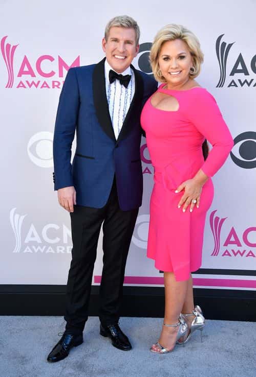 TV personalities Todd Chrisley (L) and Julie Chrisley attend the 52nd Academy Of Country Music Awards at Toshiba Plaza on April 2, 2017 in Las Vegas, Nevada. (Photo by Frazer Harrison/Getty Images)