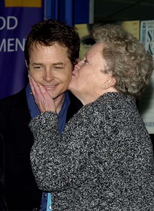 Actor Michael J. Fox gets a kiss from his mother Phyllis at the ceremony honoring him with a star on the Hollywood Walk of Fame on December 16, 2002 in Hollywood, California.