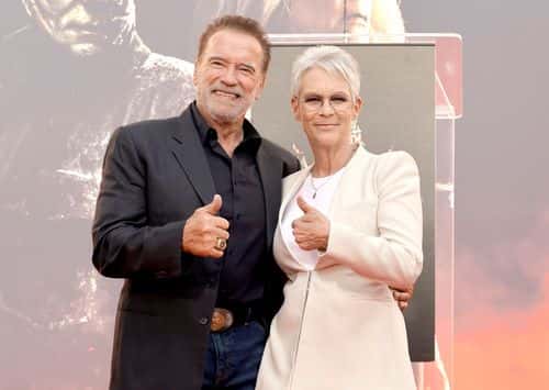(L-R) Arnold Schwarzenegger and Jamie Lee Curtis attend the Jamie Lee Curtis Hand and Footprint In Cement Ceremony at TCL Chinese Theatre on October 12, 2022 in Hollywood, California.
