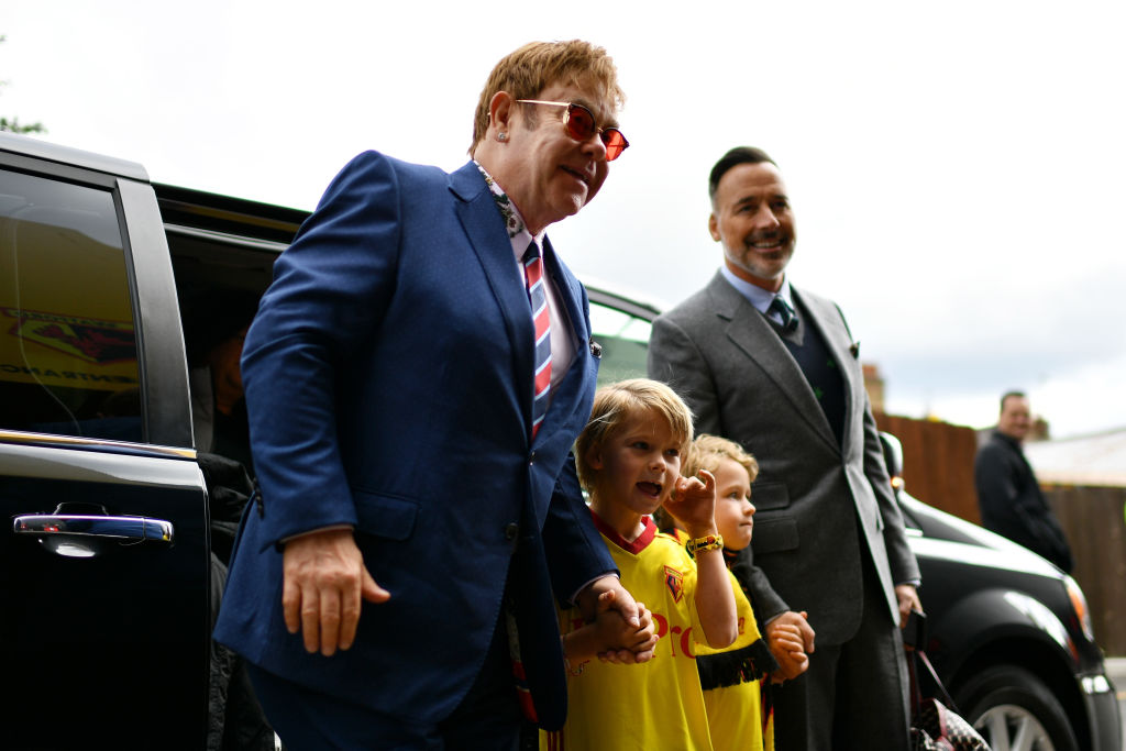 Sir Elton John, Elijah Joseph Daniel Furnish-John, Zachary Jackson Levon Furnish-John and David Furnish arrive at the stadium prior to the Premier League match between Watford and Manchester City at Vicarage Road in 2017 (Getty Images)