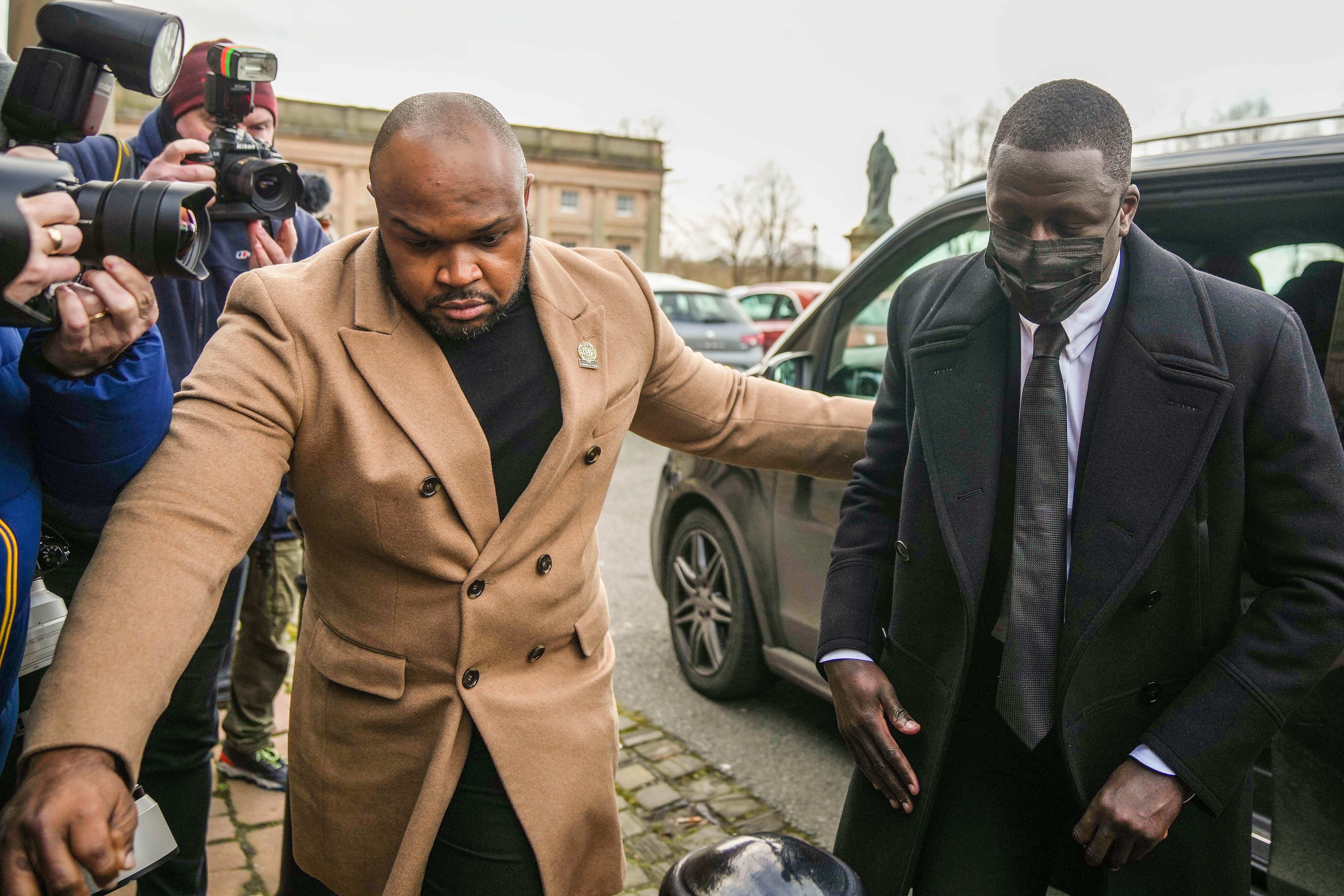 Manchester City footballer Benjamin Mendy (R) arrives at Chester Crown Court on February 2, 2022 in Chester, England. Benjamin Mendy, a defender for Manchester City Football Club, is accused of seven counts of rape and one count of sexual assault. The rape charges relate to four different women and the sexual assault charge to a fifth and are alleged to have taken place between October 2020 and August 2021.
