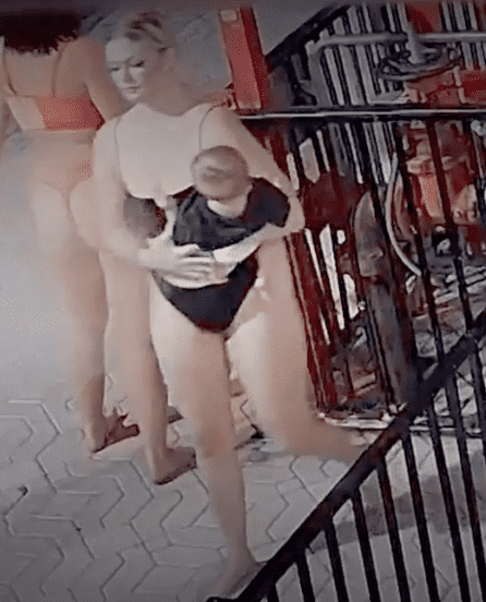 Crazy John’s Recreational Cannabis store's security camera captured Brianna Lafoe holding the baby (@fox35/Youtube)