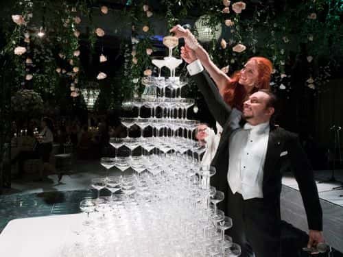 Barbara Meier and Klemens Hallmann pour the champagne tower during their wedding celebration on June 01, 2019 in Venice, Italy.