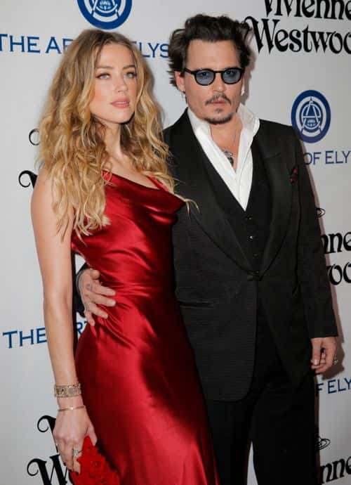 Actors Amber Heard and Johnny Depp attend The Art of Elysium 2016 HEAVEN Gala presented by Vivienne Westwood & Andreas Kronthaler at 3LABS on January 9, 2016 in Culver City, California.