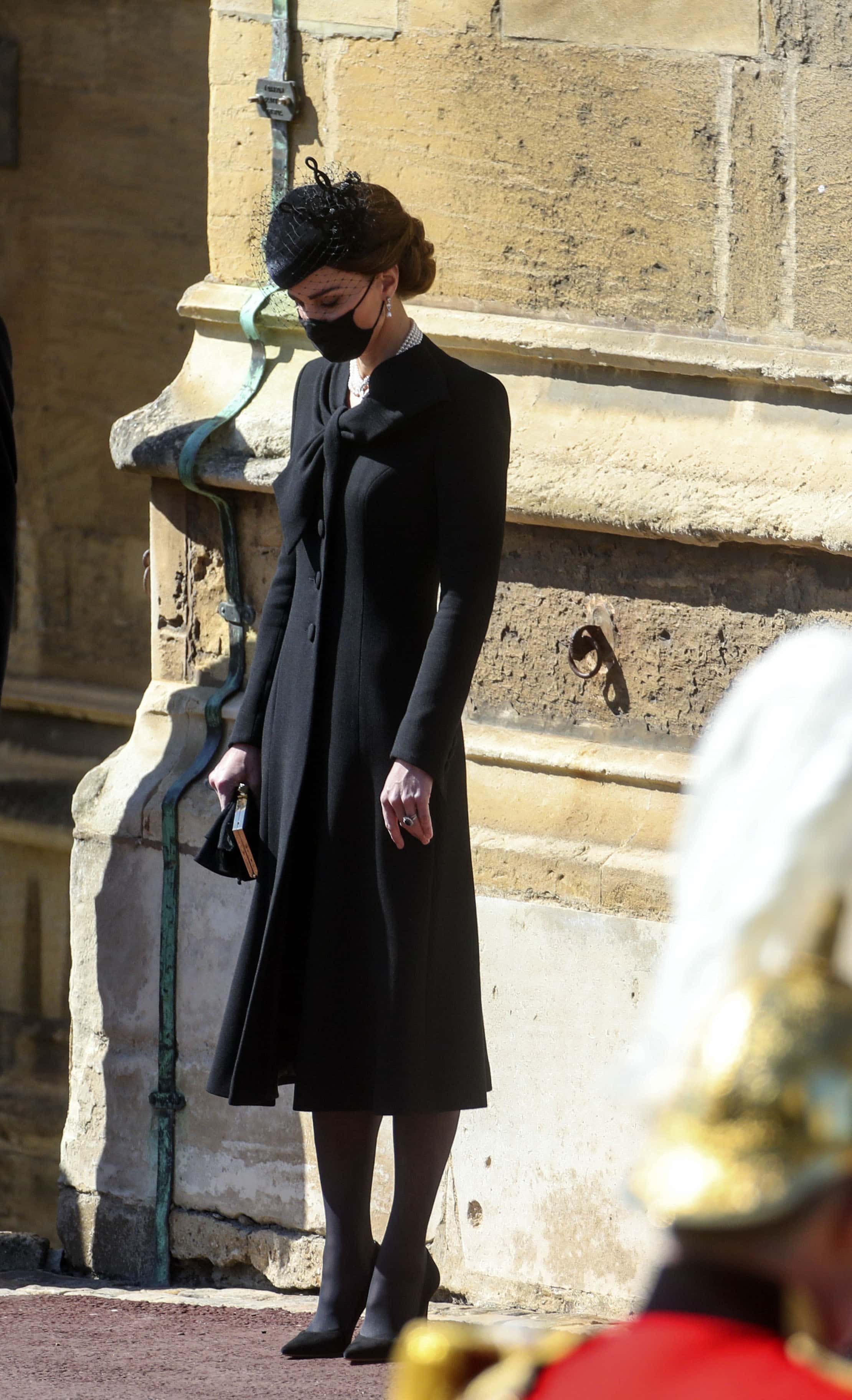 Catherine, Duchess of Cambridge bows her head as she stands at the Galilee Porch of St George's Chapel during the funeral of Prince Philip, Duke of Edinburgh, at Windsor Castle on April 17, 2021 in Windsor, England. Prince Philip of Greece and Denmark was born 10 June 1921, in Greece. He served in the British Royal Navy and fought in WWII. He married the then Princess Elizabeth on 20 November 1947 and was created Duke of Edinburgh, Earl of Merioneth, and Baron Greenwich by King VI. He served as Prince Consort to Queen Elizabeth II until his death on April 9 2021, months short of his 100th birthday. His funeral takes place today at Windsor Castle with only 30 guests invited due to Coronavirus pandemic restrictions.