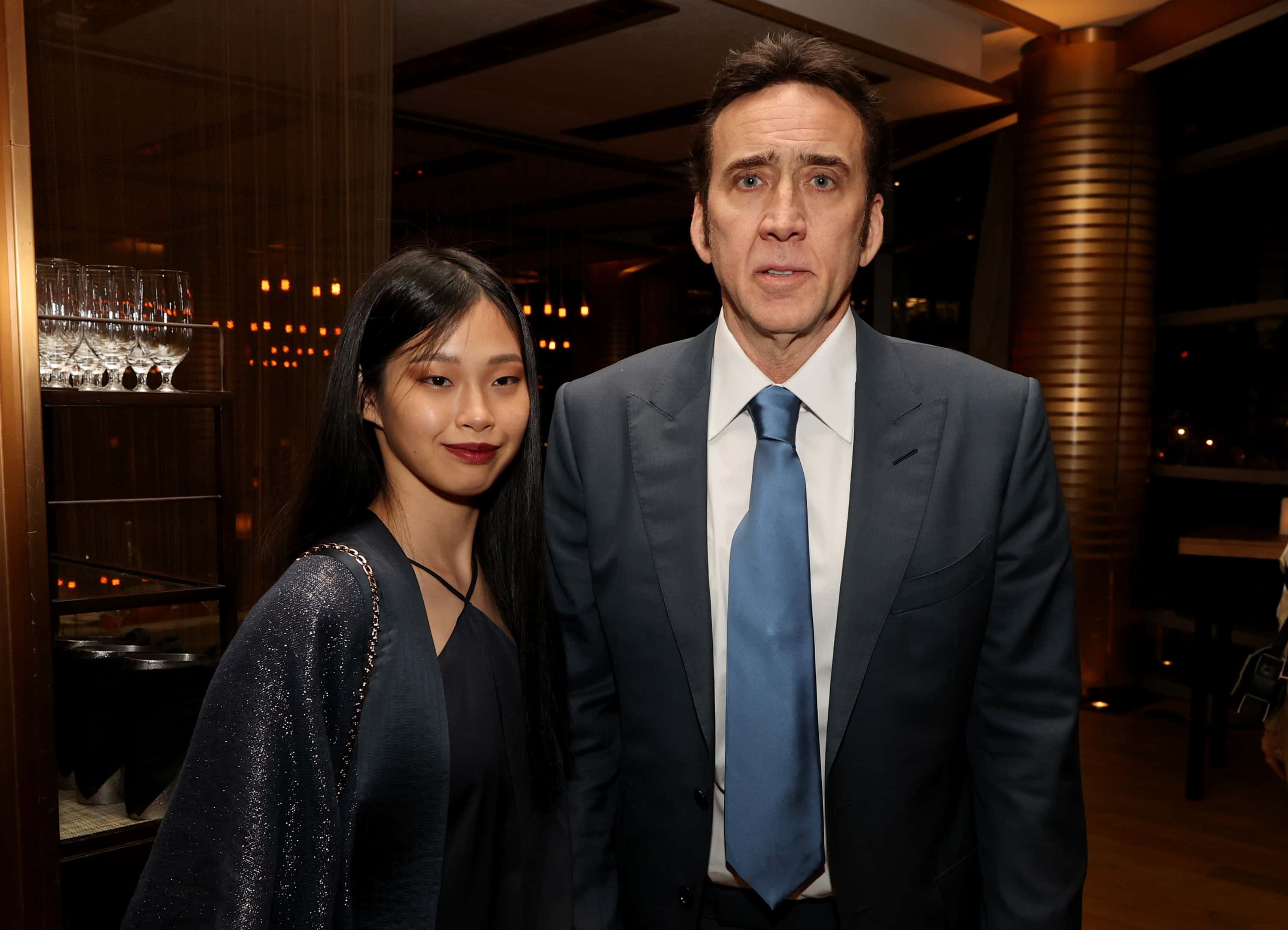 Nicolas Cage (R) and Riko Shibata pose at the after party for the premiere of Neon's