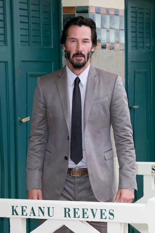 Actor Keanu Reeves poses next to the beach closet dedicated to him during a photocall on September 4, 2015 in Deauville, France. (Photo by Marc Piasecki/Getty Images)