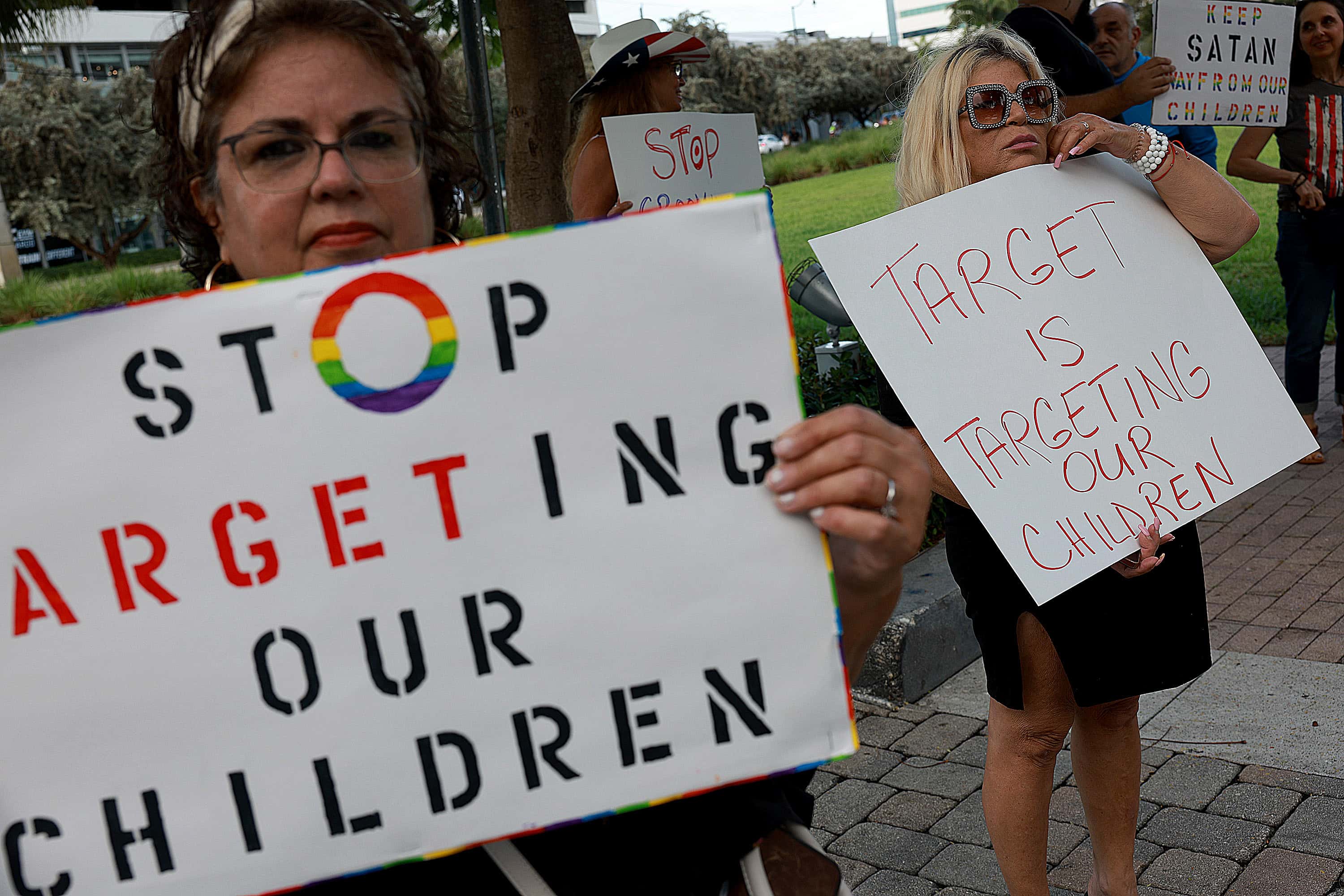 MIAMI, FLORIDA - JUNE 01: (L-R) Marlene (did not want to provide last name) and Jill Dahne protest outside of a Target store on June 01, 2023 in Miami, Florida. The protesters were reacting to Pride Month merchandise featuring the rainbow flag in support of the rights of the lesbian, gay, bisexual, transgender, and queer communities that had been sold at Target stores. Target removed certain items from its stores and made other changes to its LGBTQ+ merchandise after a backlash from some customers. (Photo by Joe Raedle/Getty Images)
