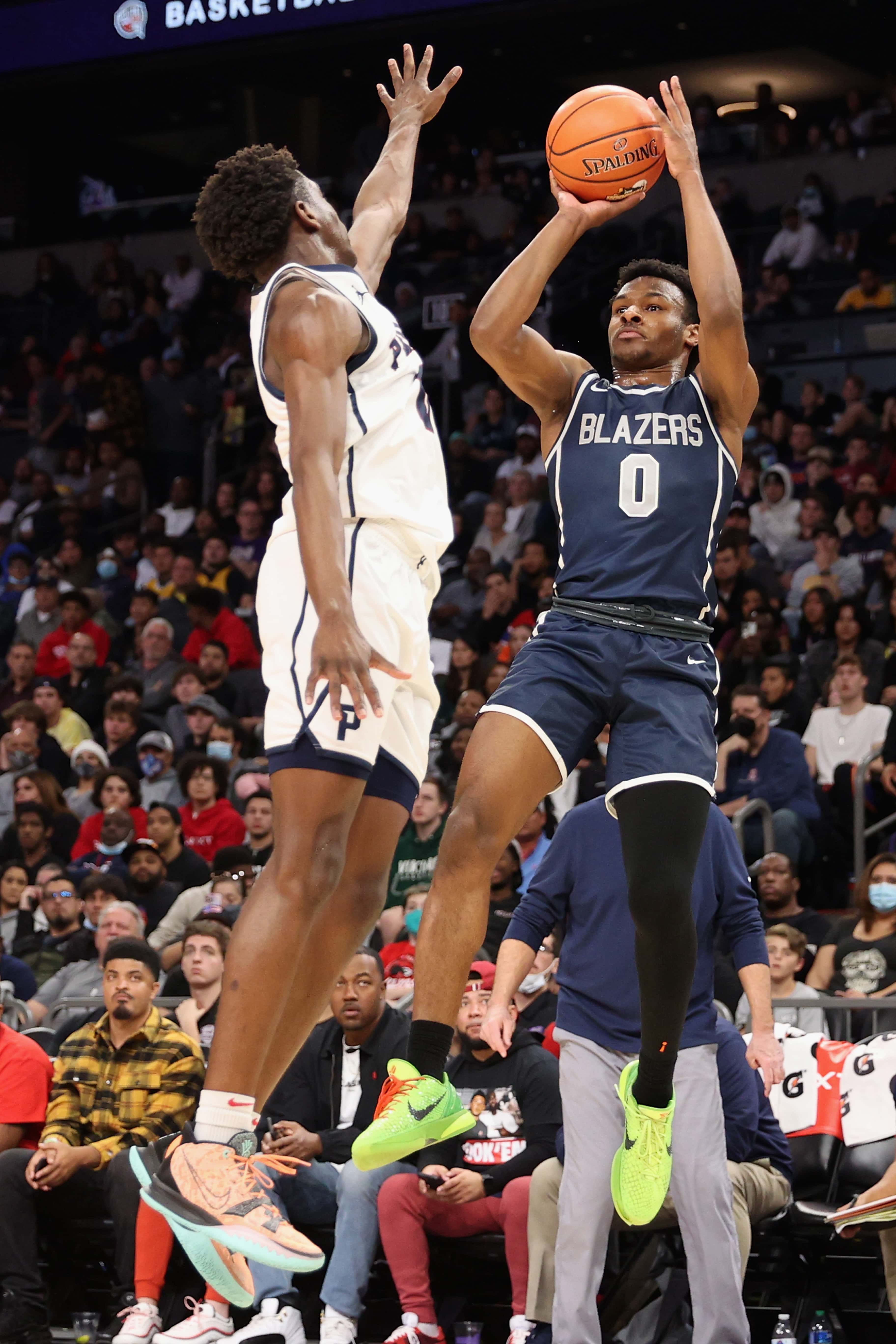 PHOENIX, ARIZONA - DECEMBER 11: Bronny James #0 of the Sierra Canyon Trailblazers attempts a three-point shot over Ben Egbo #9 of the Perry Pumas during the Hoophall West tournament at Footprint Center on December 11, 2021 in Phoenix, Arizona. (Photo by Christian Petersen/Getty Images)
