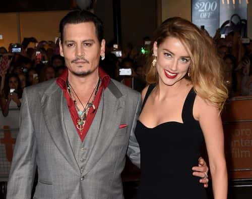 Actor Johnny Depp (L) and Actress Amber Heard attend the 