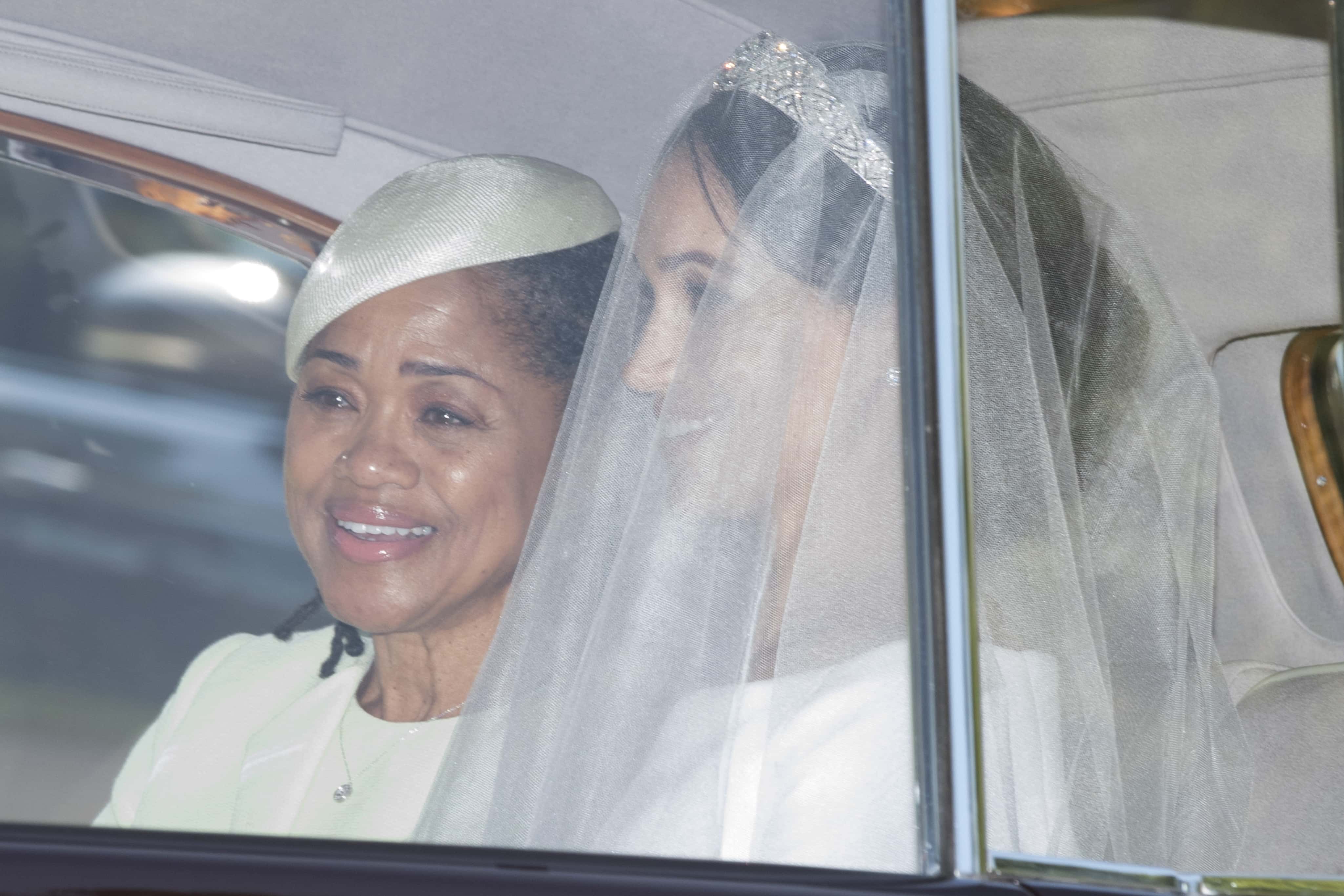 Meghan Markle and her mother Doria Ragland make their way to St George's Chapel at Windsor Castle before the wedding of Prince Harry to Meghan Markle on May 19, 2018 in Windsor, England.