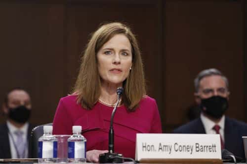 Supreme Court Justice nominee Judge Amy Coney Barrett speaks as she is sworn in during the Senate Judiciary Committee confirmation hearing for Supreme Court Justice in the Hart Senate Office Building on October 12, 2020 in Washington, DC. With less than a month until the presidential election, President Donald Trump tapped Amy Coney Barrett to be his third Supreme Court nominee in just four years. If confirmed, Barrett would replace the late Associate Justice Ruth Bader Ginsburg.