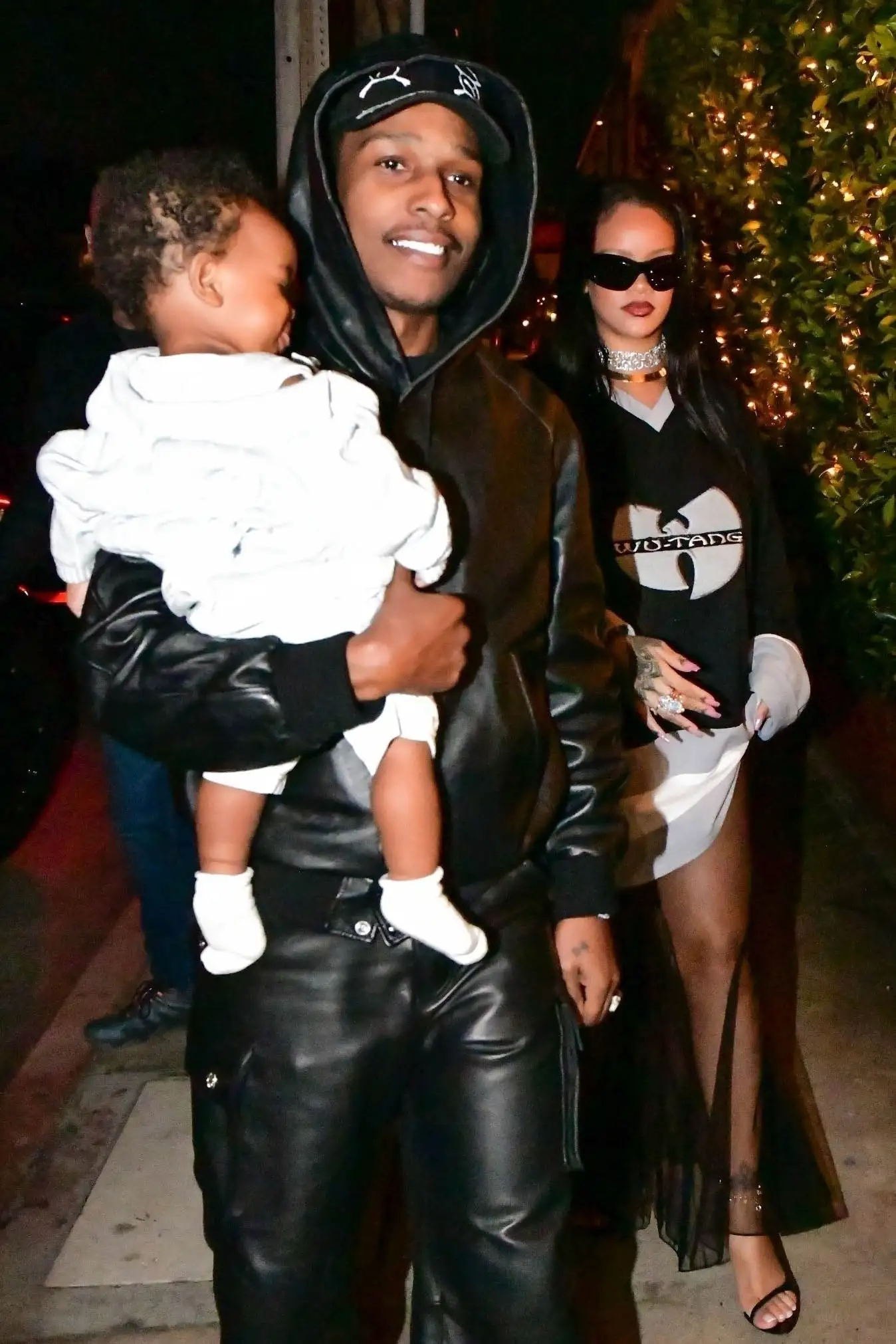 The singer, 35, is expecting her second child with partner A$AP Rocky, 34, looked glamorous mum as father-to-be carried his smiling 10-month-old son in her arms (backgrid)