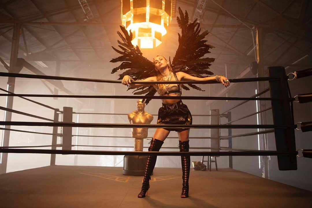 Miley Cyrus in the 'Don't Call Me Angel' music video (Ariana Grade/Youtube)