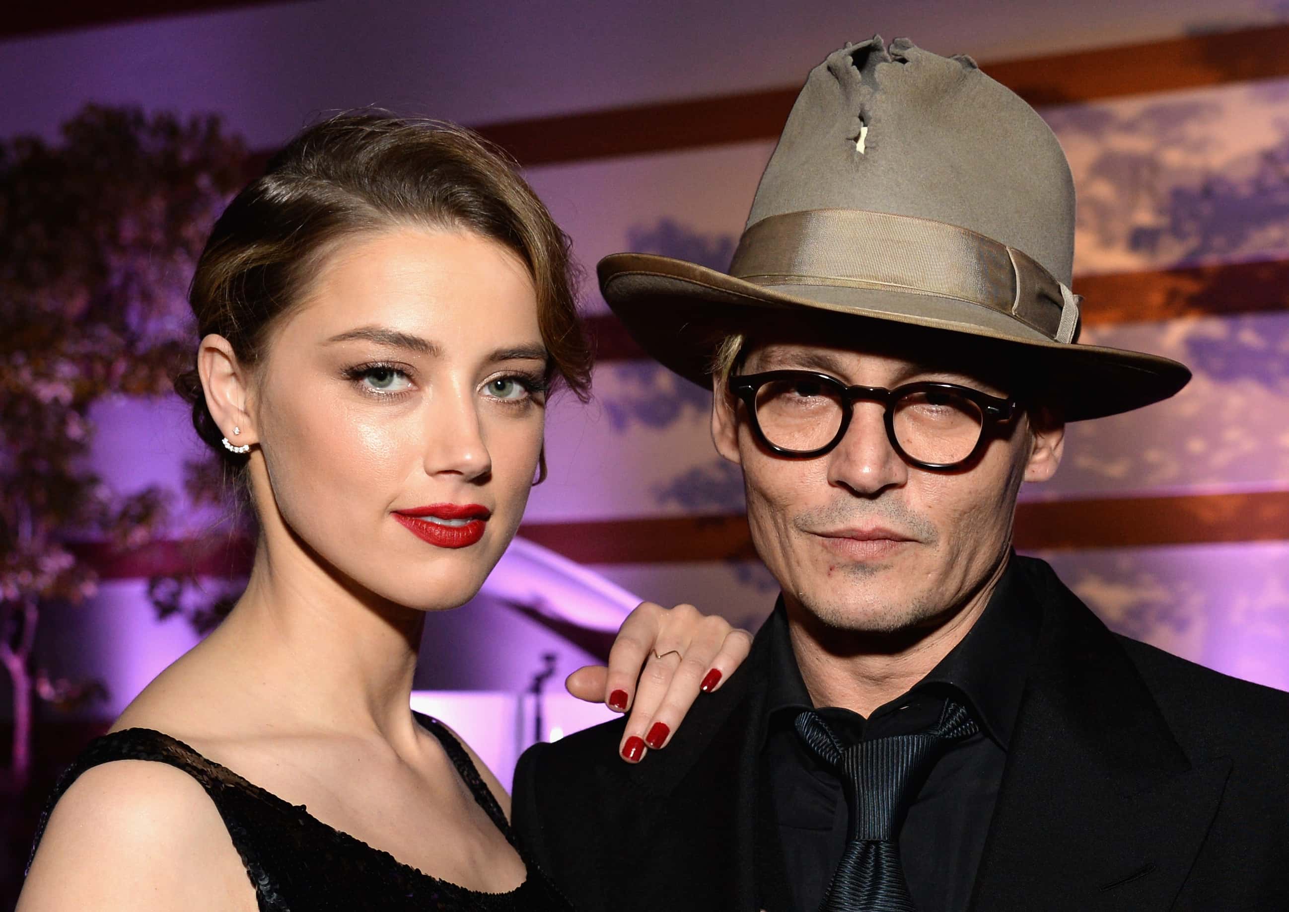 Actors Amber Heard (L) and Johnny Depp attend The Art of Elysium's 7th Annual HEAVEN Gala presented by Mercedes-Benz at Skirball Cultural Center on January 11, 2014 in Los Angeles, California. (Photo by Michael Kovac/Getty Images for Art of Elysium)