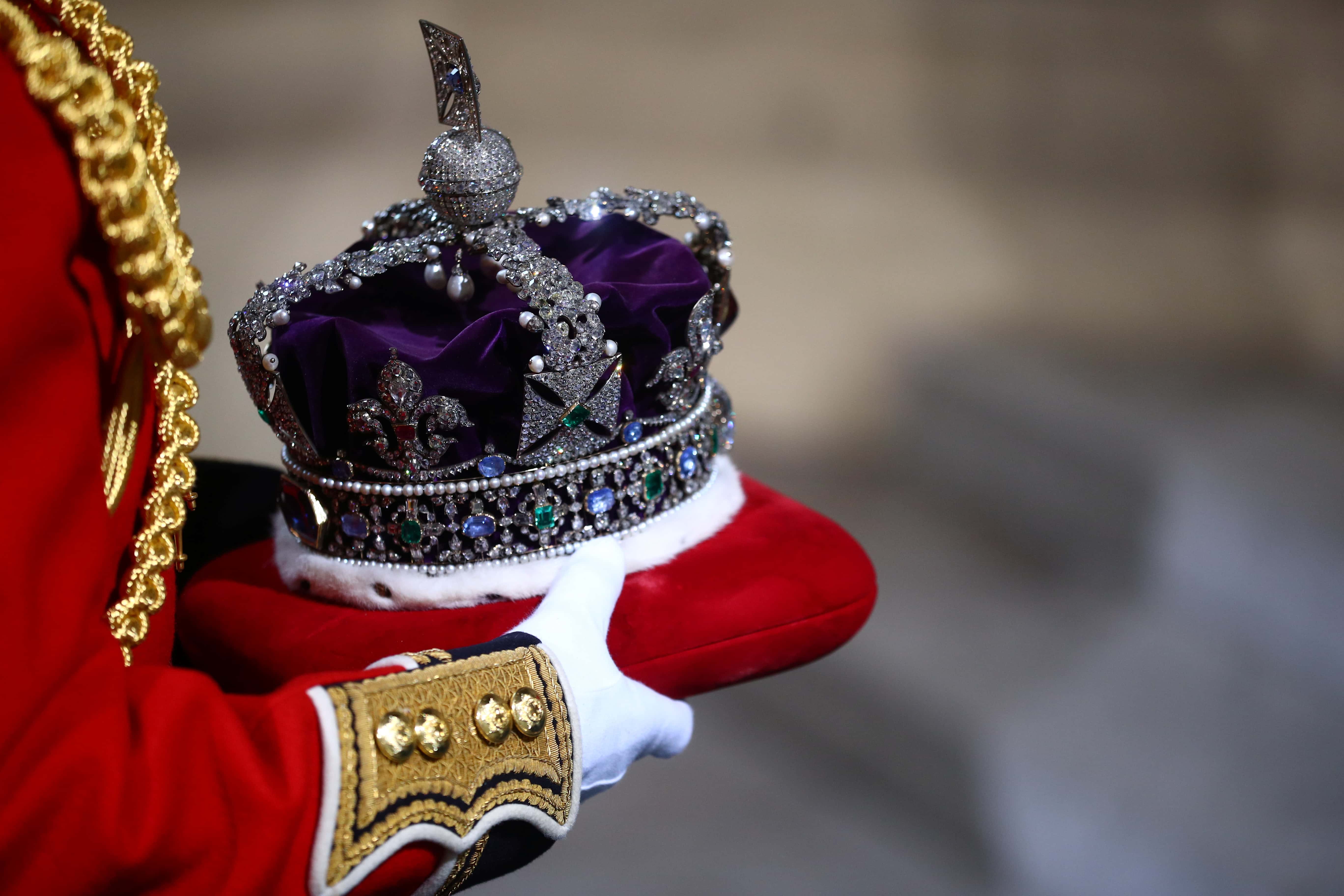 The crown of Queen Elizabeth II is carried during for the State Opening of Parliament at the Palace of Westminster on October 14, 2019 in London, England. The Queen's speech is expected to announce Plans to end the free movement of EU citizens to the UK after Brexit, New laws on crime, health and the environment.