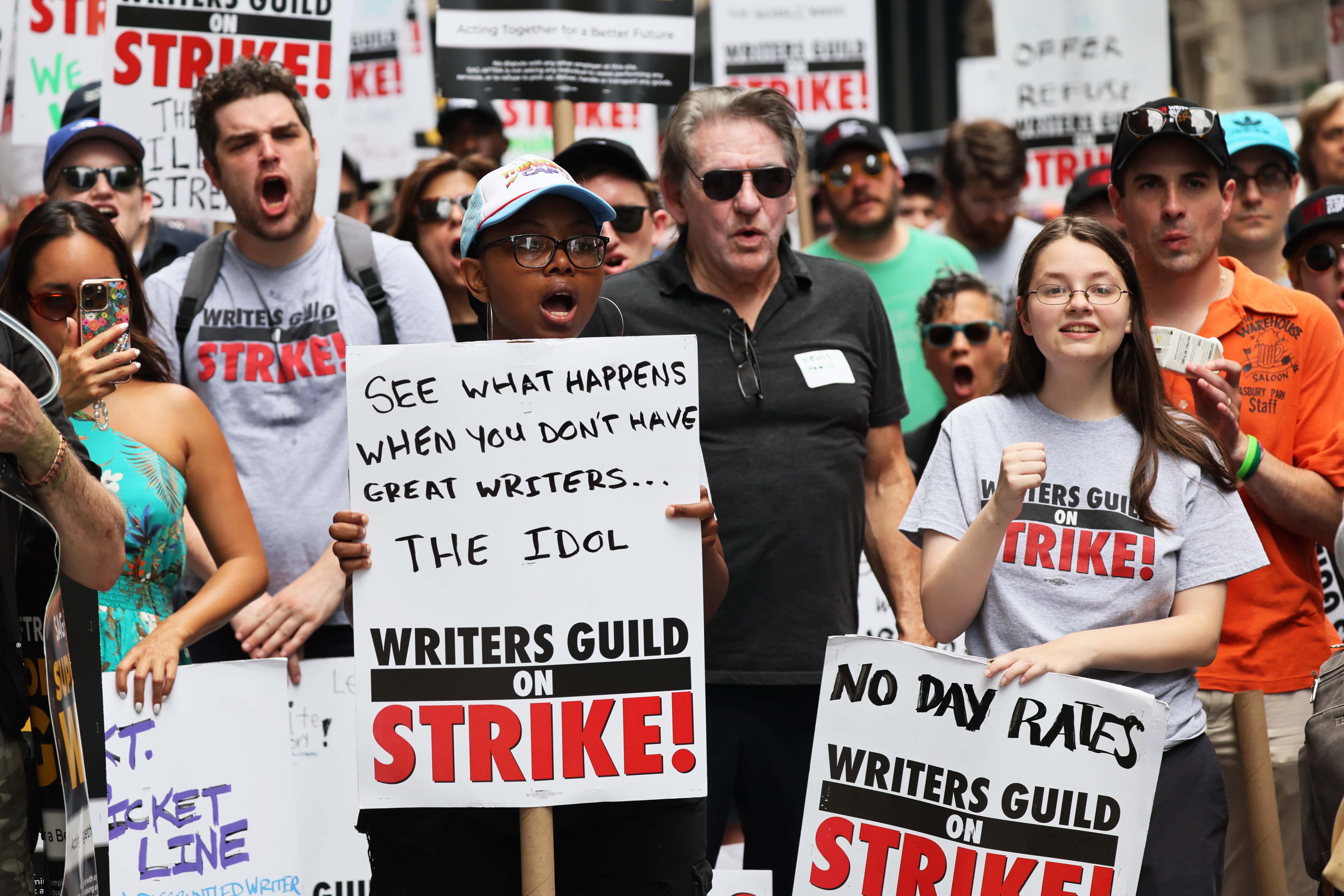 Members of the Writers Guild of America East are joined by SAG-AFTRA members as they picket at the Warner Bros. Discovery NYC office on July 13, 2023 in New York City. SAG-AFTRA members joined a picketline with WGA members for a Support Staff Solidarity Day, a day after their contract expired and with membership previously authorizing a strike, with nearly 98 percent of voters in favor. WGA have been on strike since May 2.