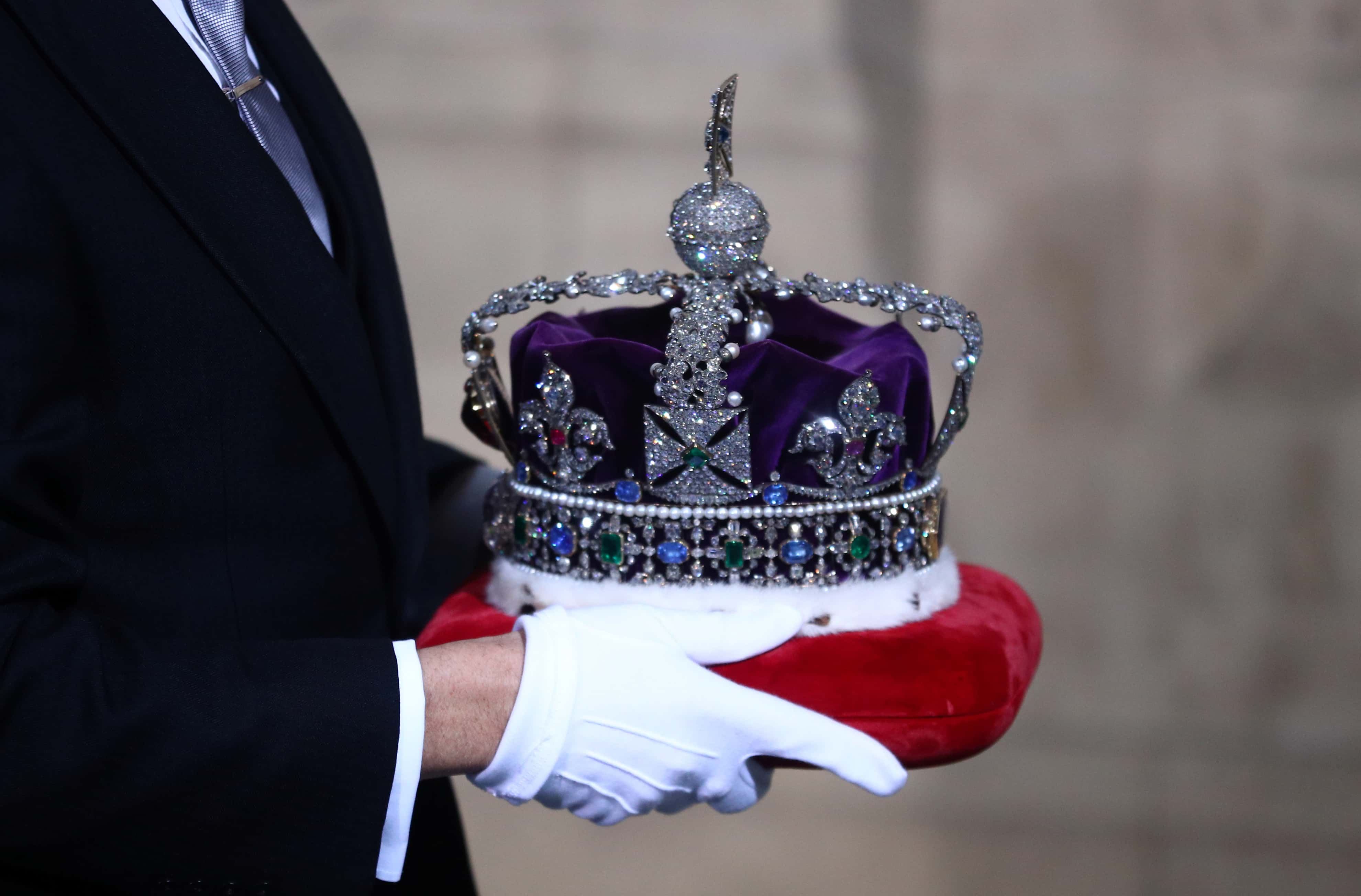The crown of Queen Elizabeth II is carried during for the State Opening of Parliament at the Palace of Westminster on October 14, 2019 in London, England. The Queen's speech is expected to announce Plans to end the free movement of EU citizens to the UK after Brexit, New laws on crime, health and the environment.