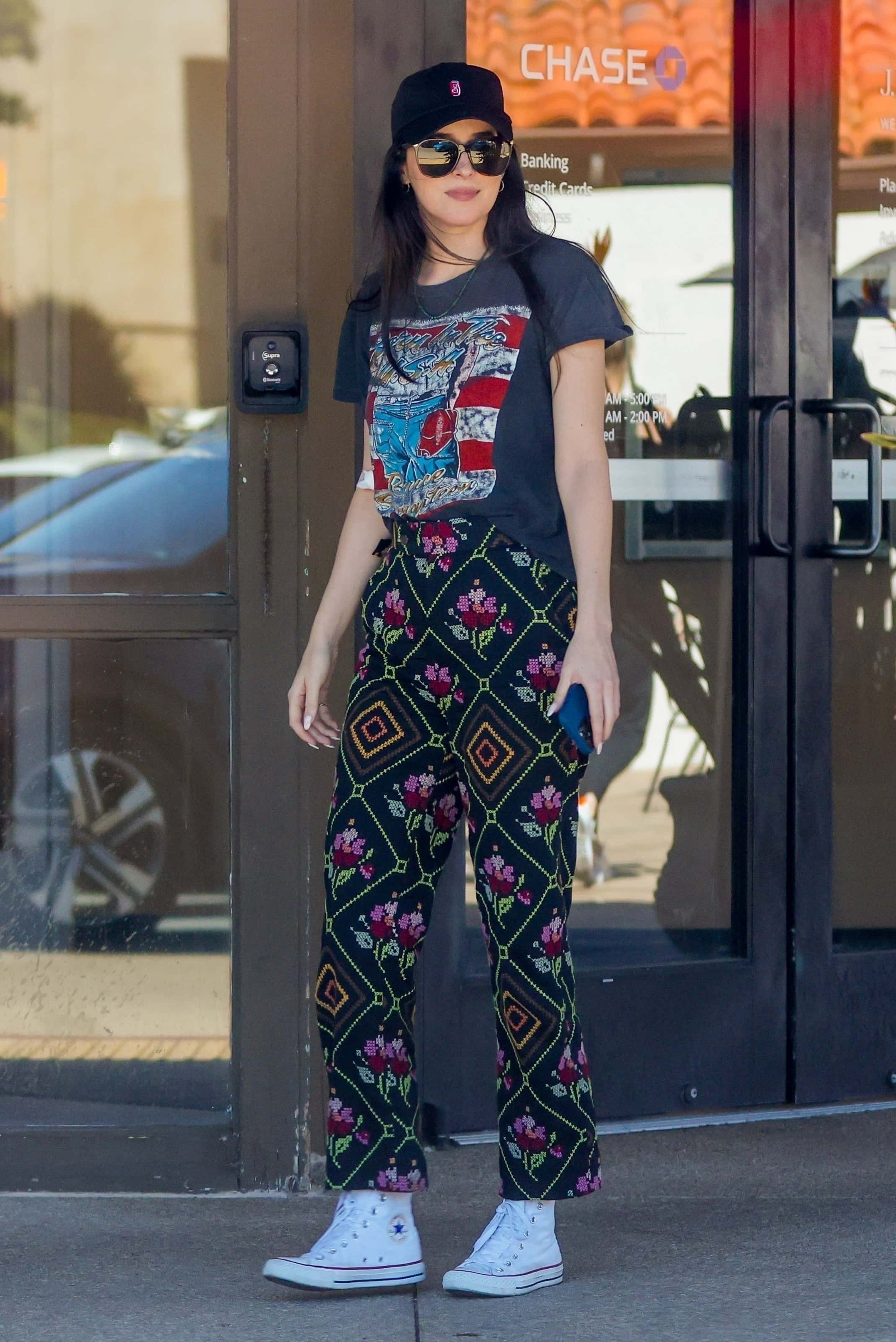 Dakota sported a little bandage on her arm, maybe from giving blood for medical testing before to flying with Chris (backgrid)