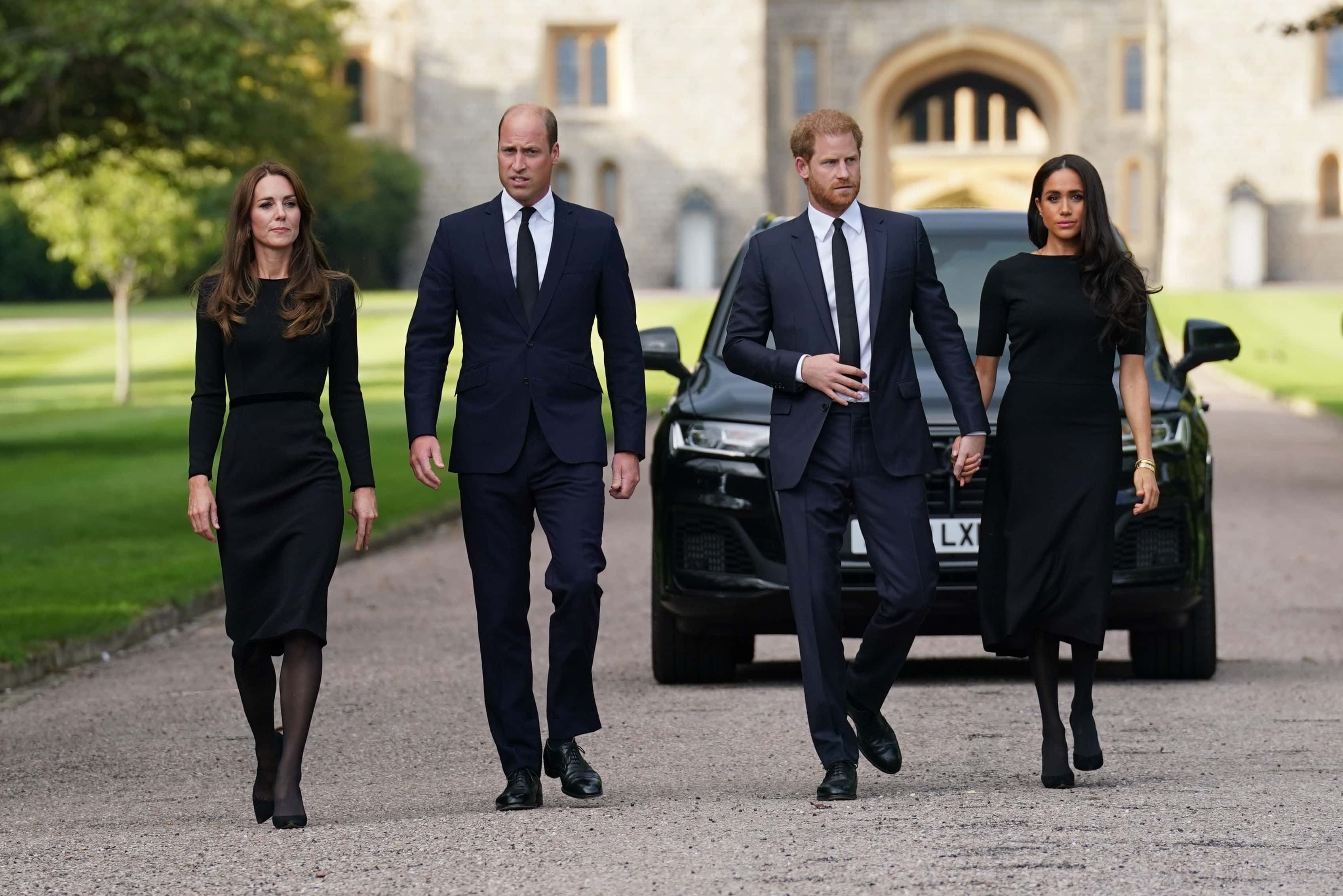 Catherine, Princess of Wales, Prince William, Prince of Wales, Prince Harry, Duke of Sussex, and Meghan, Duchess of Sussex on the long Walk at Windsor Castle on September 10, 2022 in Windsor, England. Crowds have gathered and tributes left at the gates of Windsor Castle to Queen Elizabeth II, who died at Balmoral Castle on 8 September, 2022.