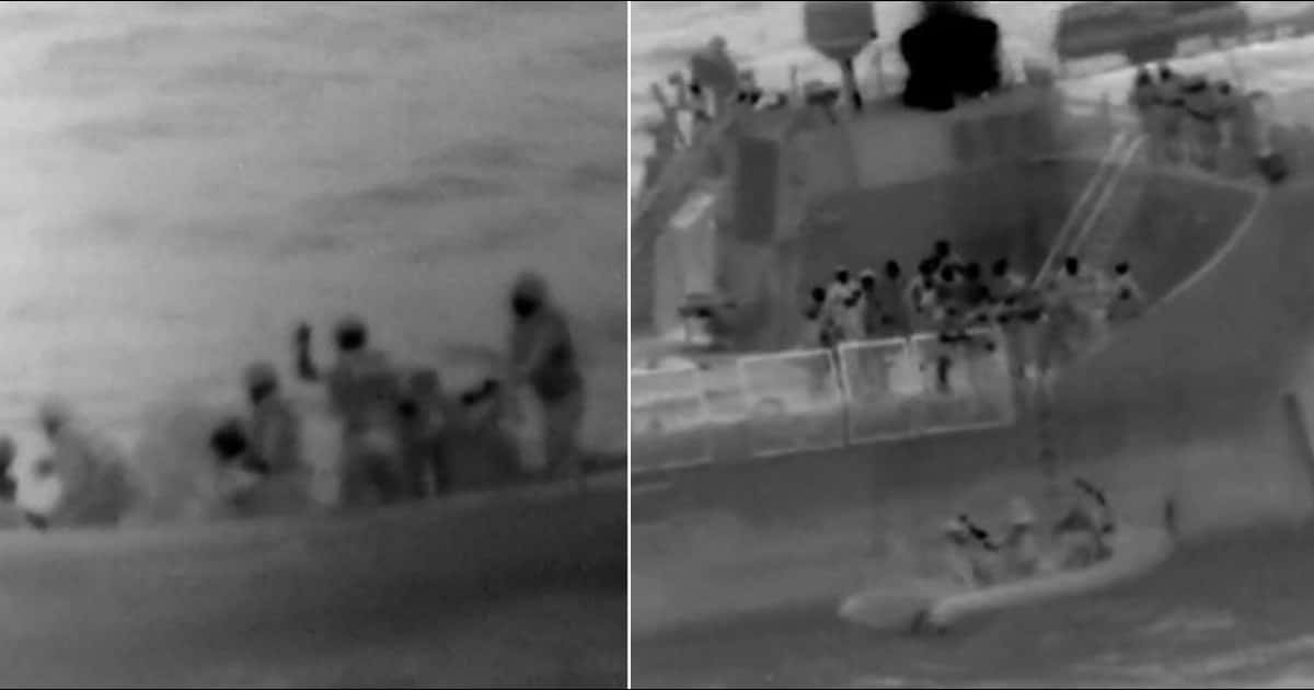 Four males being rescued by the US Coast Guard (USCG)