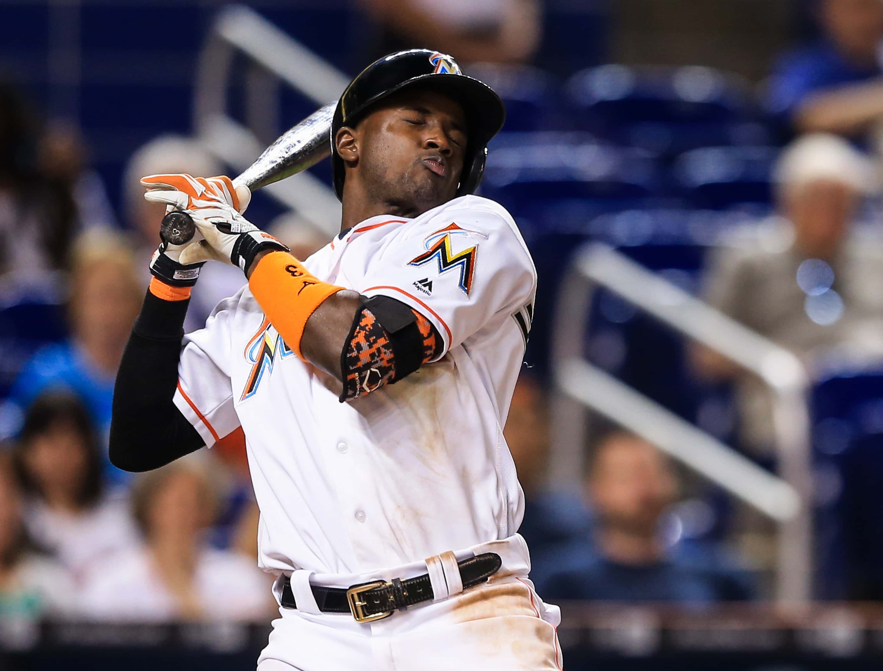 Adeiny Hechavarria #3 of the Miami Marlins reacts to an inside pitch during the eighth inning of the game against the Tampa Bay Rays at Marlins Park on May 23, 2016 in Miami, Florida.
