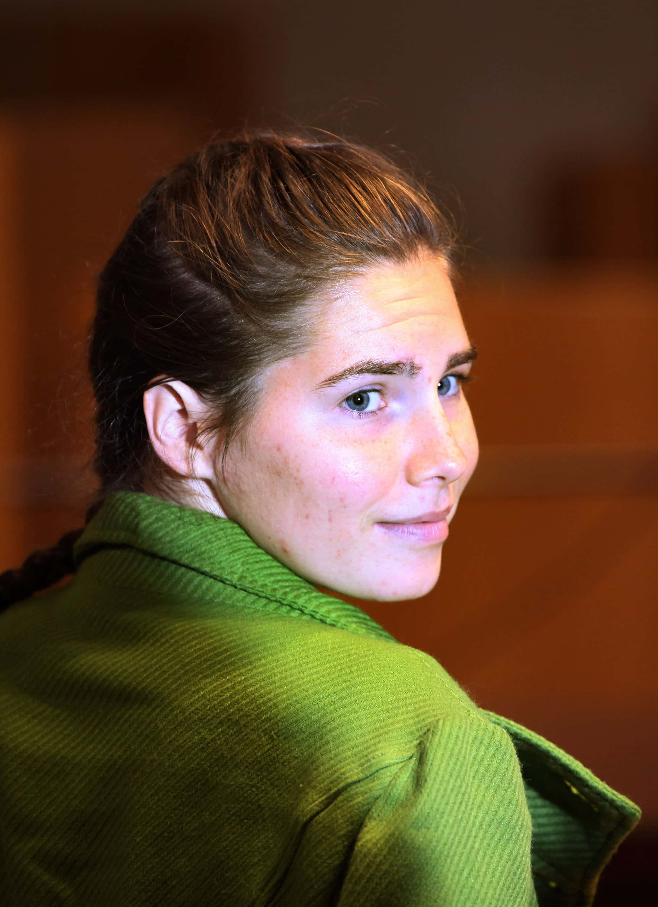 PERUGIA, ITALY - DECEMBER 04:  Defendant Amanda Knox takes a seat next to her lawyers on the final d