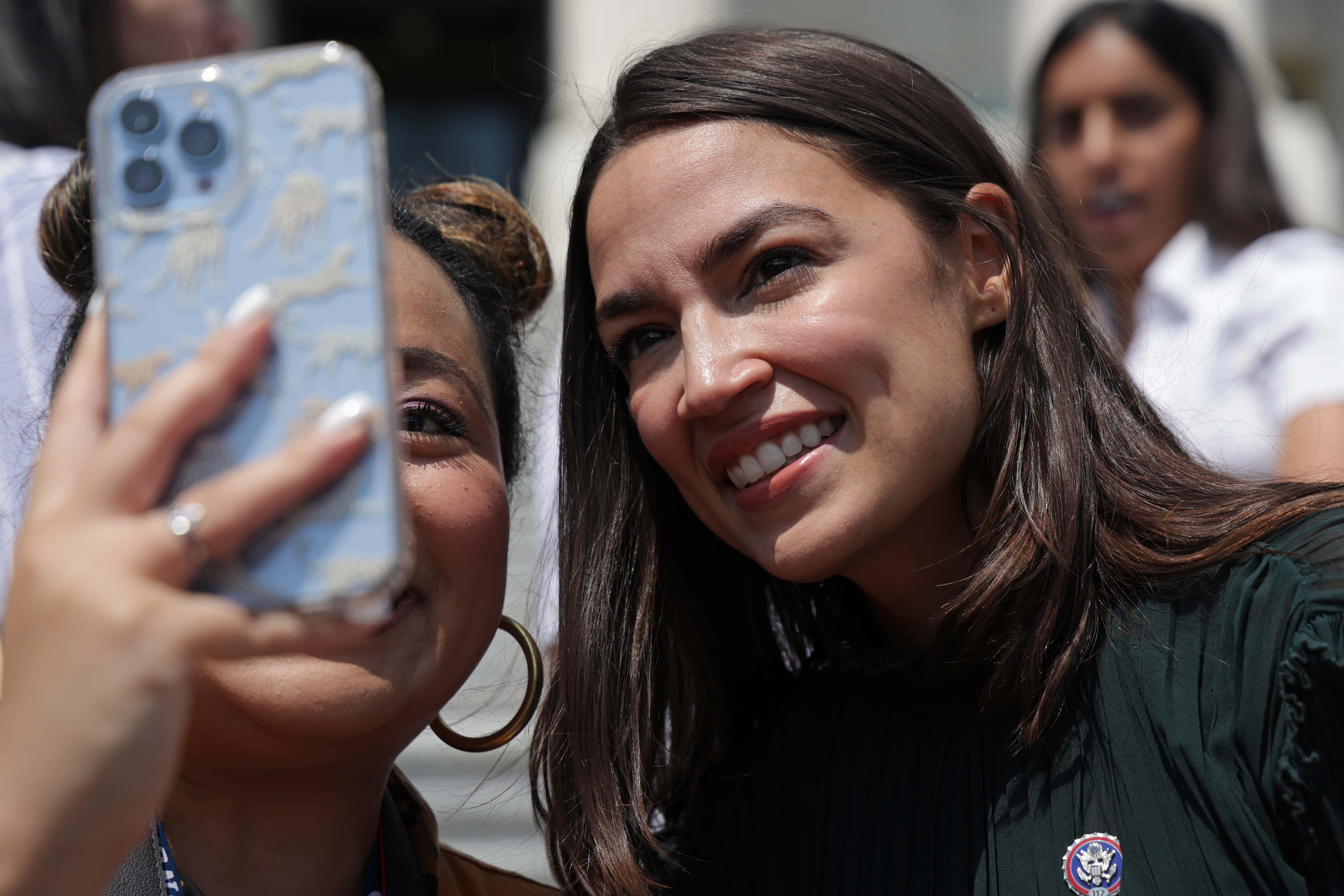 U.S. Rep. Alexandria Ocasio-Cortez (D-NY) takes selfie with reproductive right advocates after a press event in front of the U.S. Capitol July 15, 2022 in Washington, DC. The House is voting on the Women’s Health Protection Act today. (Photo by Alex Wong/Getty Images)