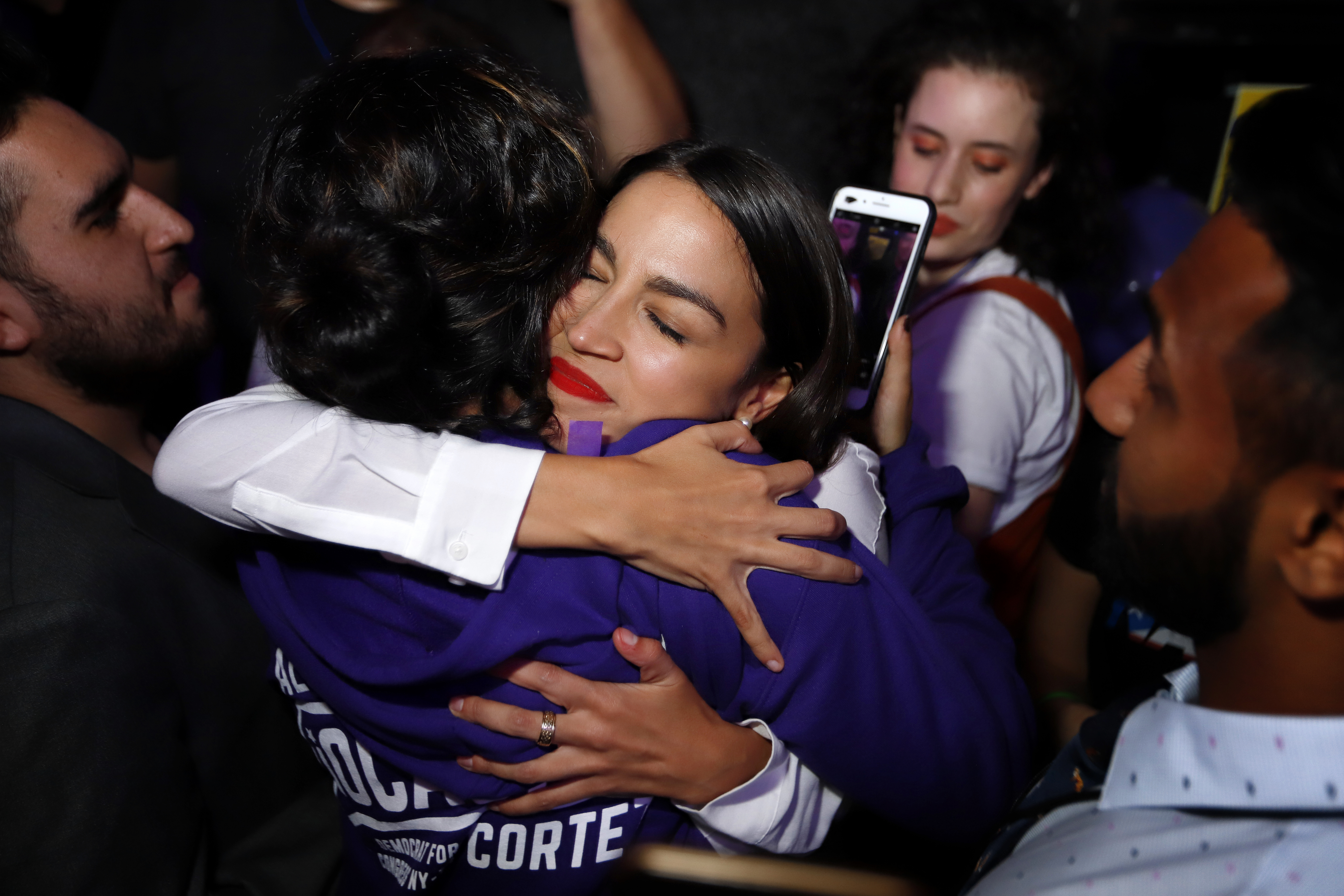 Alexandria Ocasio-Cortez hugs a supporter during her victory celebration at La Boom nightclub in Queens on November 6, 2018, in New York City. (Getty Images)