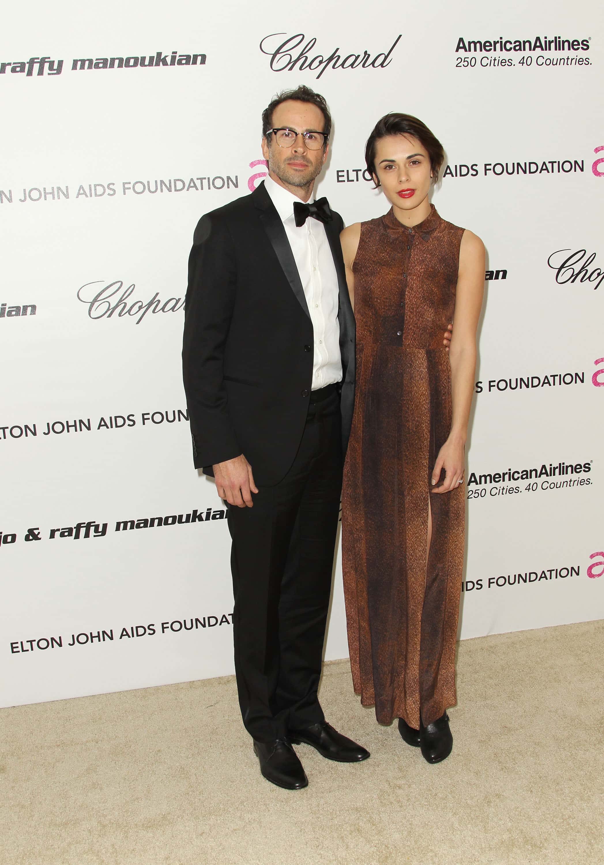 Actor Jason Lee and Ceren Alkac arrive at the 19th Annual Elton John AIDS Foundation's Oscar viewing party held at the Pacific Design Center on February 27, 2011, in West Hollywood, California. (Photo by Frederick M. Brown/Getty Images)