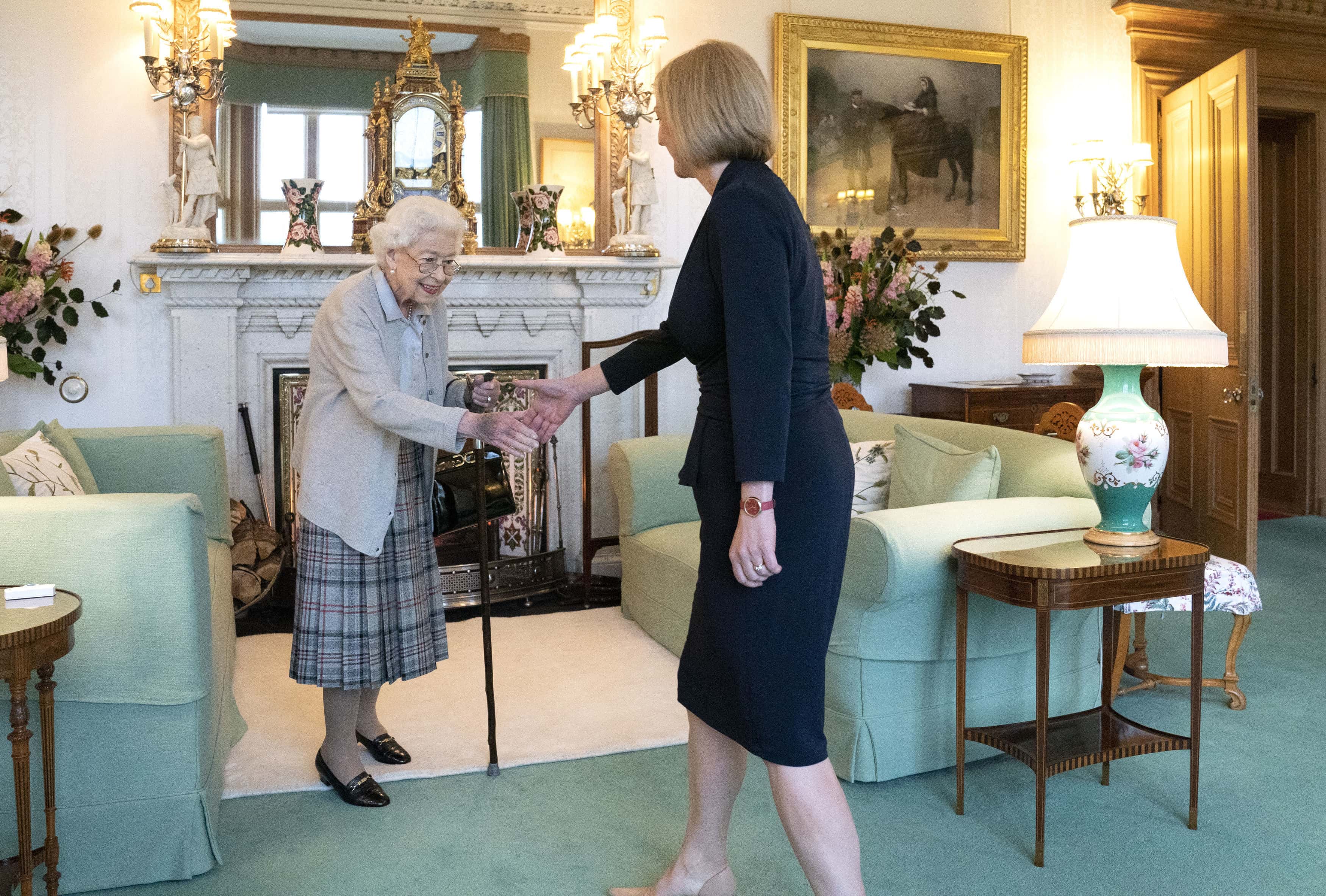 Queen Elizabeth greets newly elected leader of the Conservative party Liz Truss as she arrives at Balmoral Castle for an audience where she will be invited to become Prime Minister and form a new government on September 6, 2022 in Aberdeen, Scotland. The Queen broke with the tradition of meeting the new prime minister and Buckingham Palace, after needing to remain at Balmoral Castle due to mobility issues.