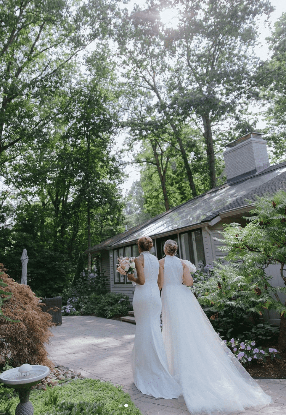 'GMA' Robin Roberts & Amber Laign walked hand-in-hand in their bridal gowns (@robintobertsgma/Instagram)