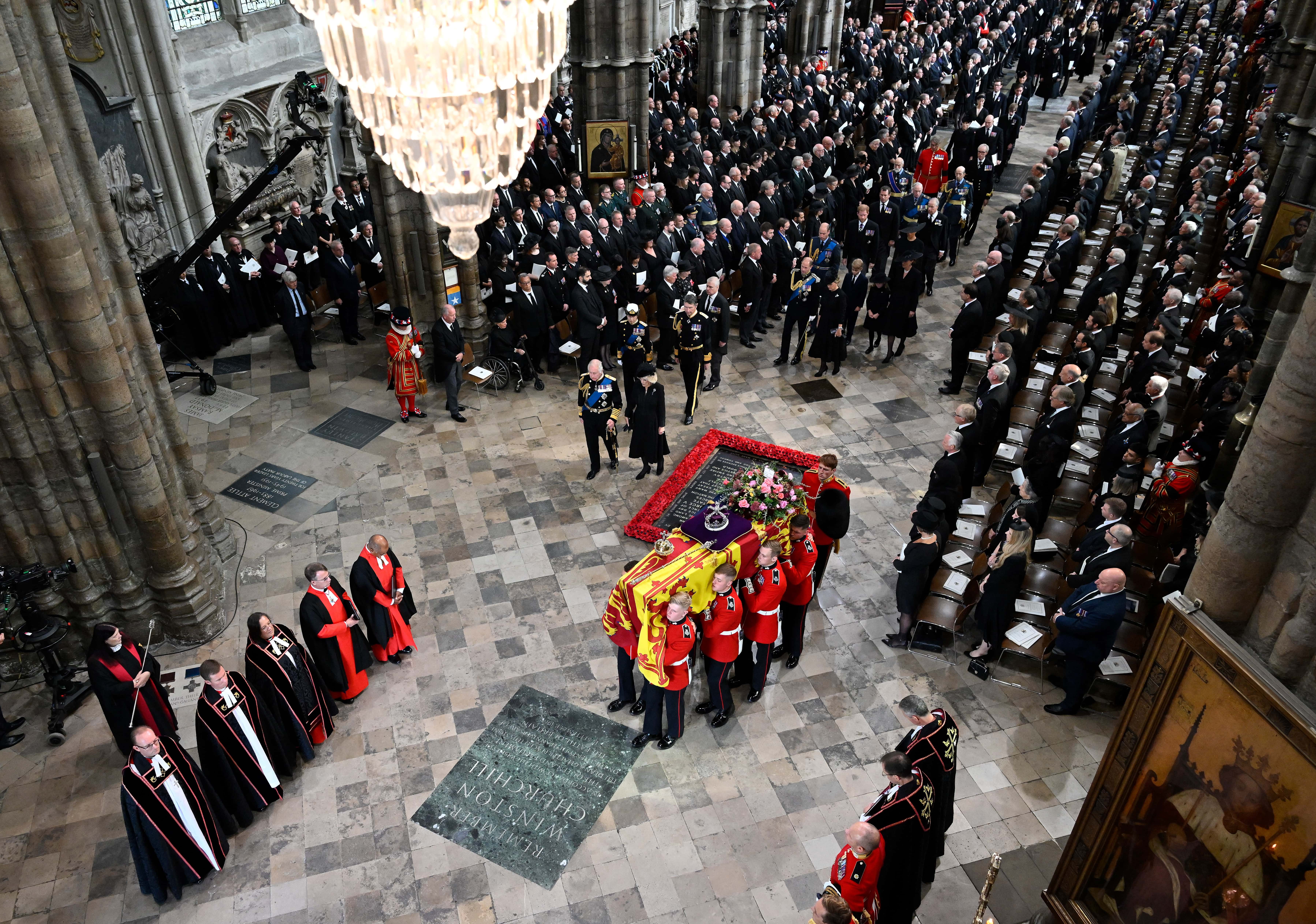 The coffin of Queen Elizabeth II with the Imperial State Crown resting on top of it departs Westminster Abbey during the State Funeral of Queen Elizabeth II on September 19, 2022 in London, England. (Photo by Gareth Cattermole/Getty Images)