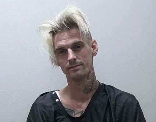 In this handout photo provided by the Habersham Co Sheriff Office, Singer Aaron Carter poses for his booking photo after being charged for marijuana possession and suspicion of driving under the influence on July 15, 2017 in Clarkesville, Georgia. Carter's girlfriend, Madison Parker who was with him, was also arrested with drug-related charges and obstruction.