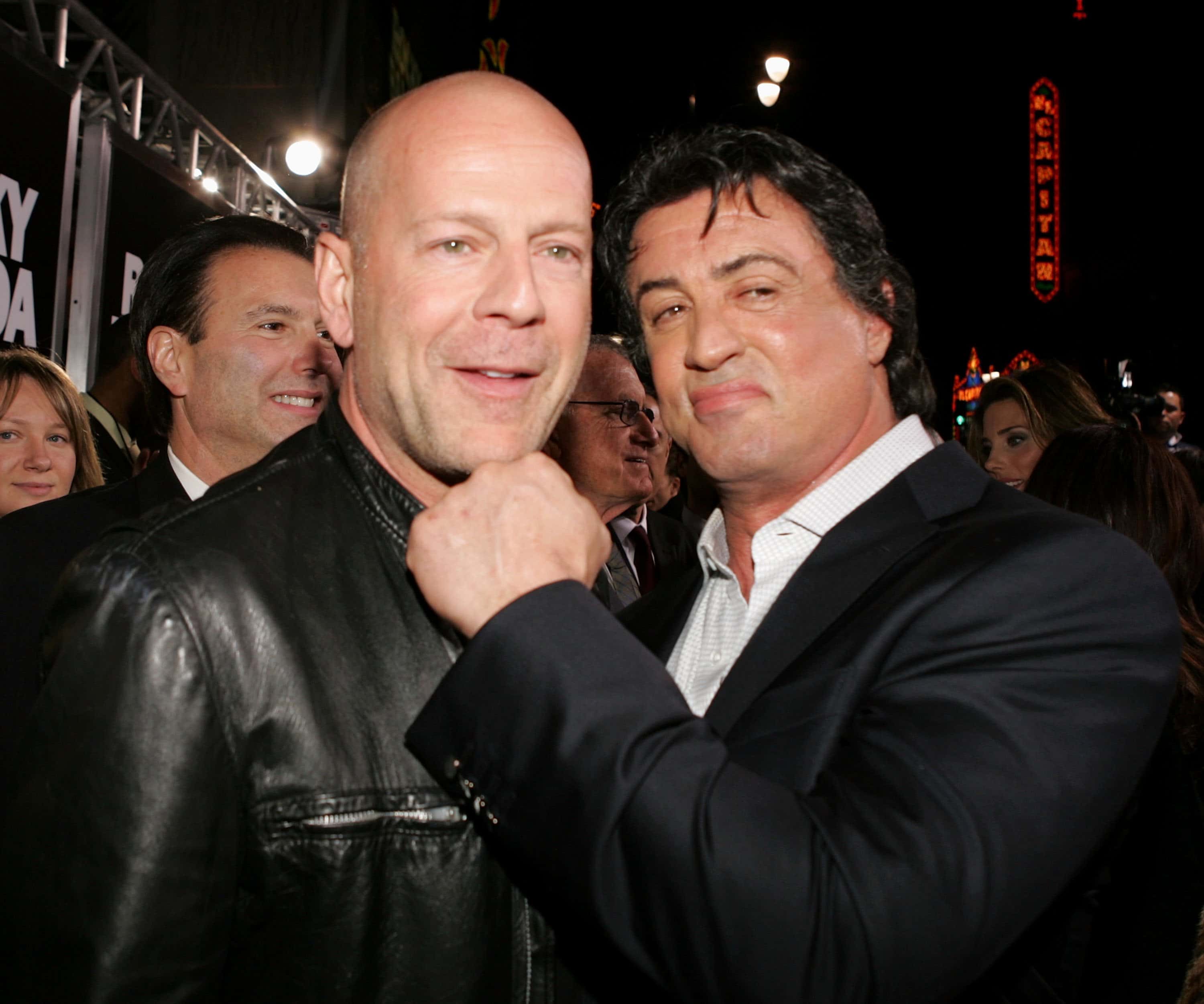 Actors Bruce Willis and Sylvester Stallone arrive at the premiere of MGM's 