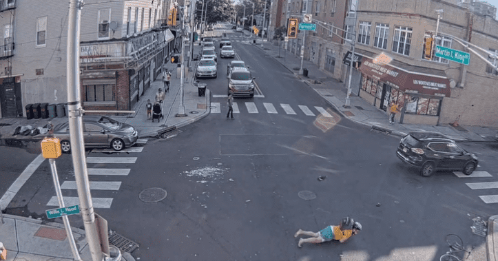 Amy Degise's SUV seen speeding away after hitting the cyclist, who fell to the ground (@HeinisHardNews/Twitter)