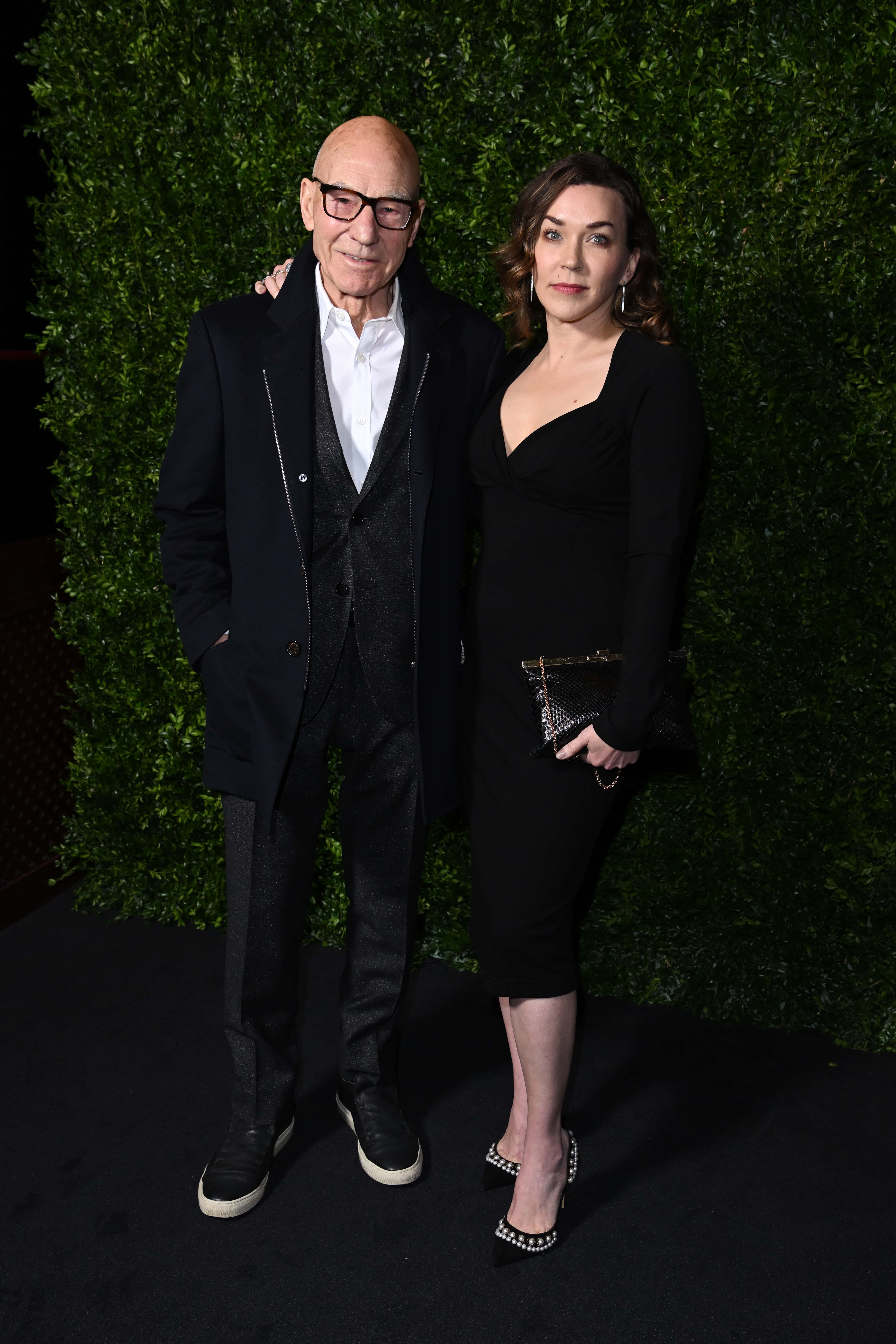 Patrick Stewart and Sunny Ozell attend Charles Finch x CHANEL - The Night Before BAFTA Dinner at Hertford Street Club on March 12, 2022 in London, England.