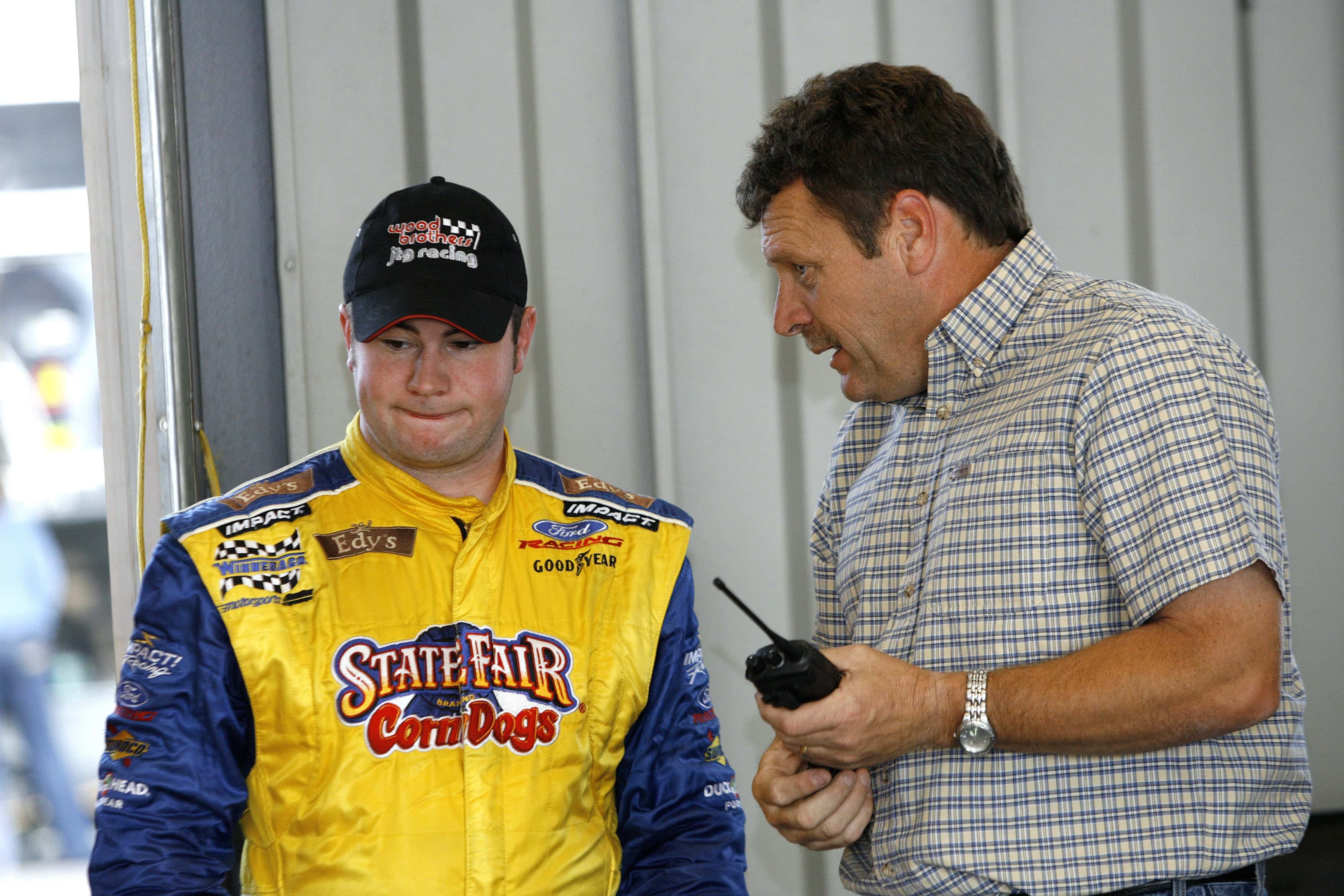 Bobby East, driver of the #21 State Fair Corn Dogs/Edy's Dibs Ford, talks with former series driver Robert Pressley during the NASCAR Craftsman Truck Series Built Ford Tough 225 practice on July 7, 2006 at the Kentucky Speedway in Sparta, Kentucky. (Photo by Joe Robbins/Getty Images for NASCAR)