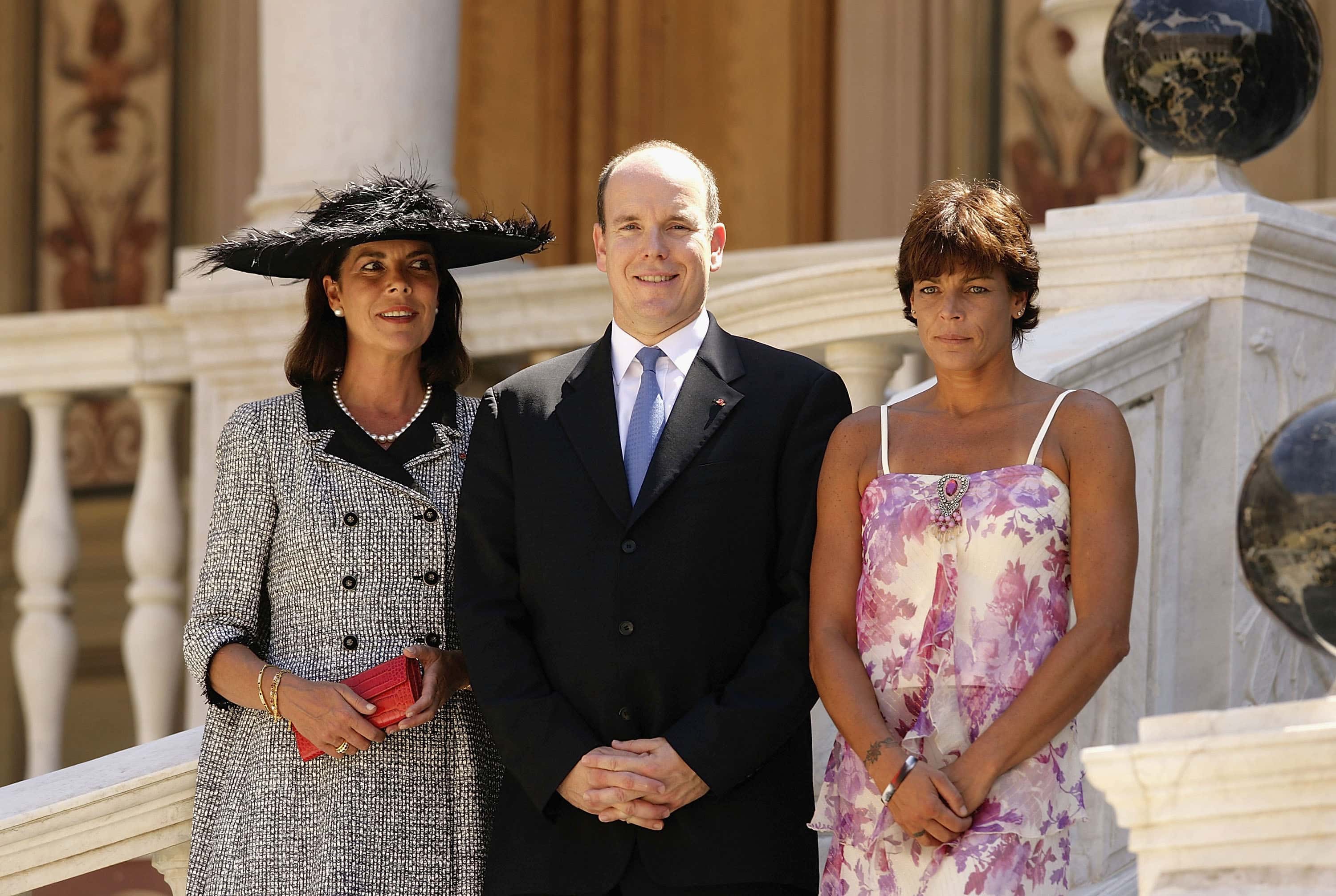 (L to R) Princess Caroline of Monaco, Prince Albert II of Monaco, and Princess Stephanie of Monaco pose in the courtyard of the Palace of Monaco for an official photograph on July 12, 2005, in Monte Carlo, Monaco. The photo call is part of the day's official events surrounding His Serene Highness Prince Albert II's Official Enthronement. (Photo by Pascal Le Segretain/Getty Images)