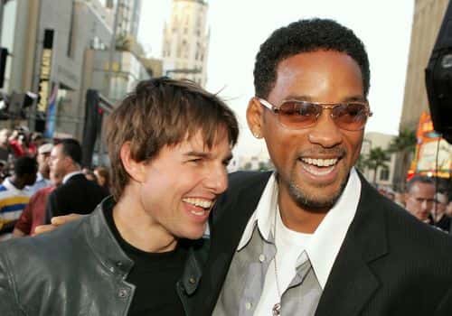 Actor Tom Cruise (L) and actor Will Smith arrive at the Los Angeles Fan Screening of 